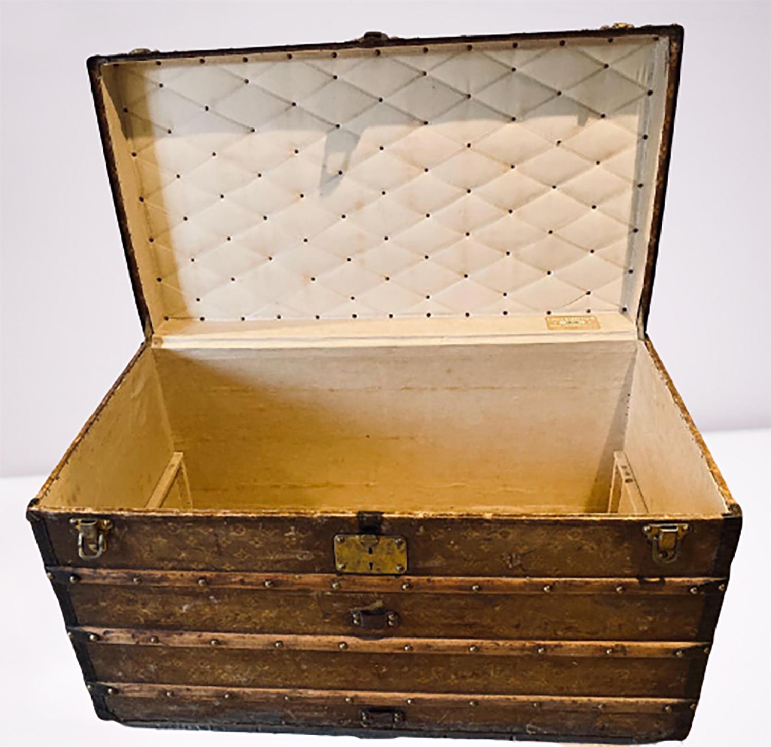 Louis Vuitton Monograph steamer trunk. This finely constructed steamer trunk is still strong and sturdy as it seems to have traveled the world. This 1905 early steamer has it original rollers on the base as well as all of the original hardware.
A