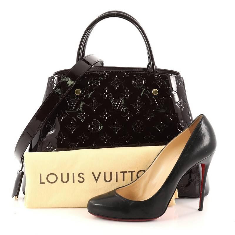 This authentic Louis Vuitton Montaigne Handbag Monogram Vernis MM named after the famed Parisian location is as sophisticated as it is sturdy. Crafted from amarante purple monogram vernis leather, this bag features dual-rolled handles, detachable