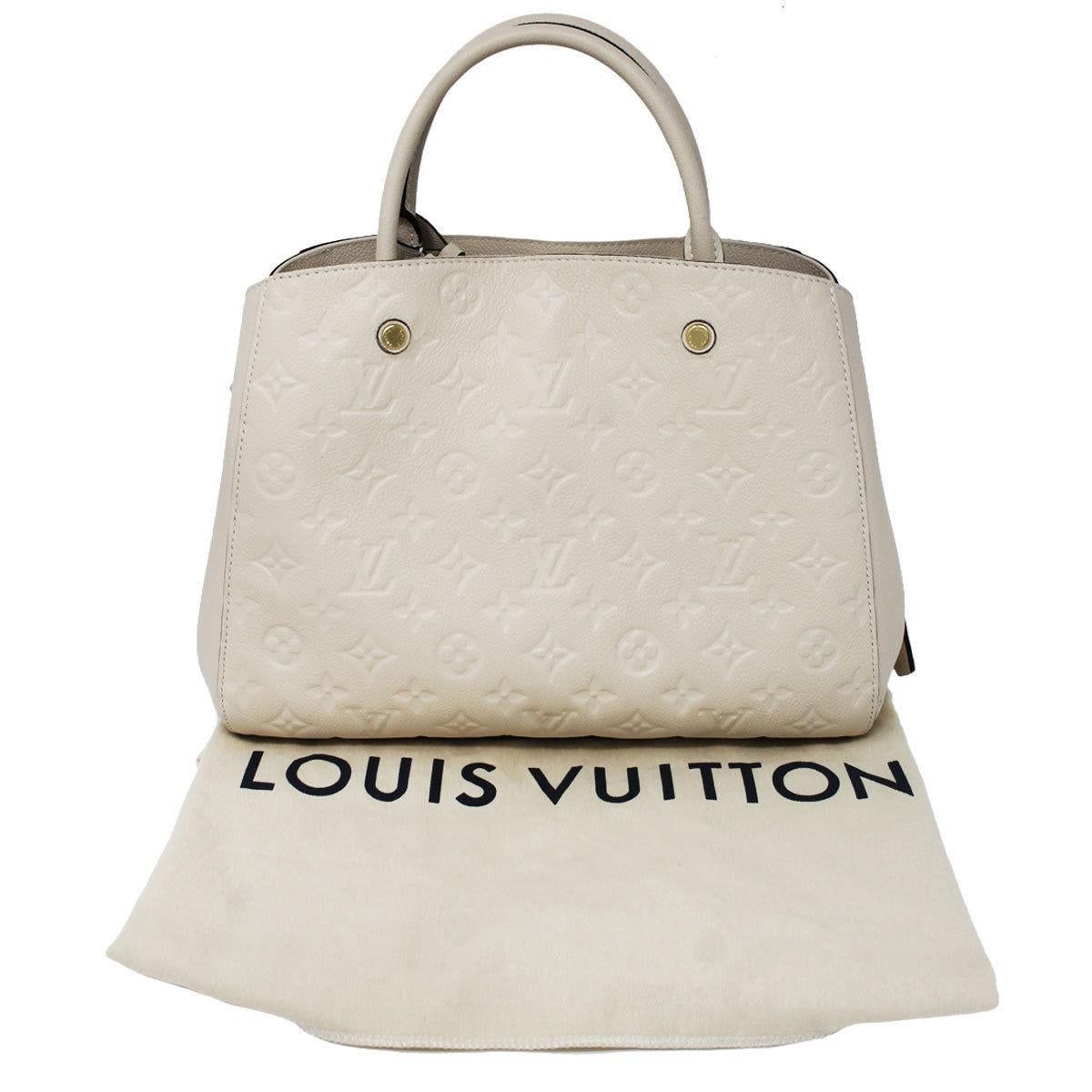 Louis Vuitton Montaigne Neige Empreinte Handbag With Dust Bag In Excellent Condition In Boca Raton, FL