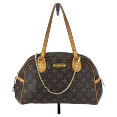 LOUIS VUITTON MONTORGUEIL PM  Sac à main porté à l'épaule en toile avec monogramme 