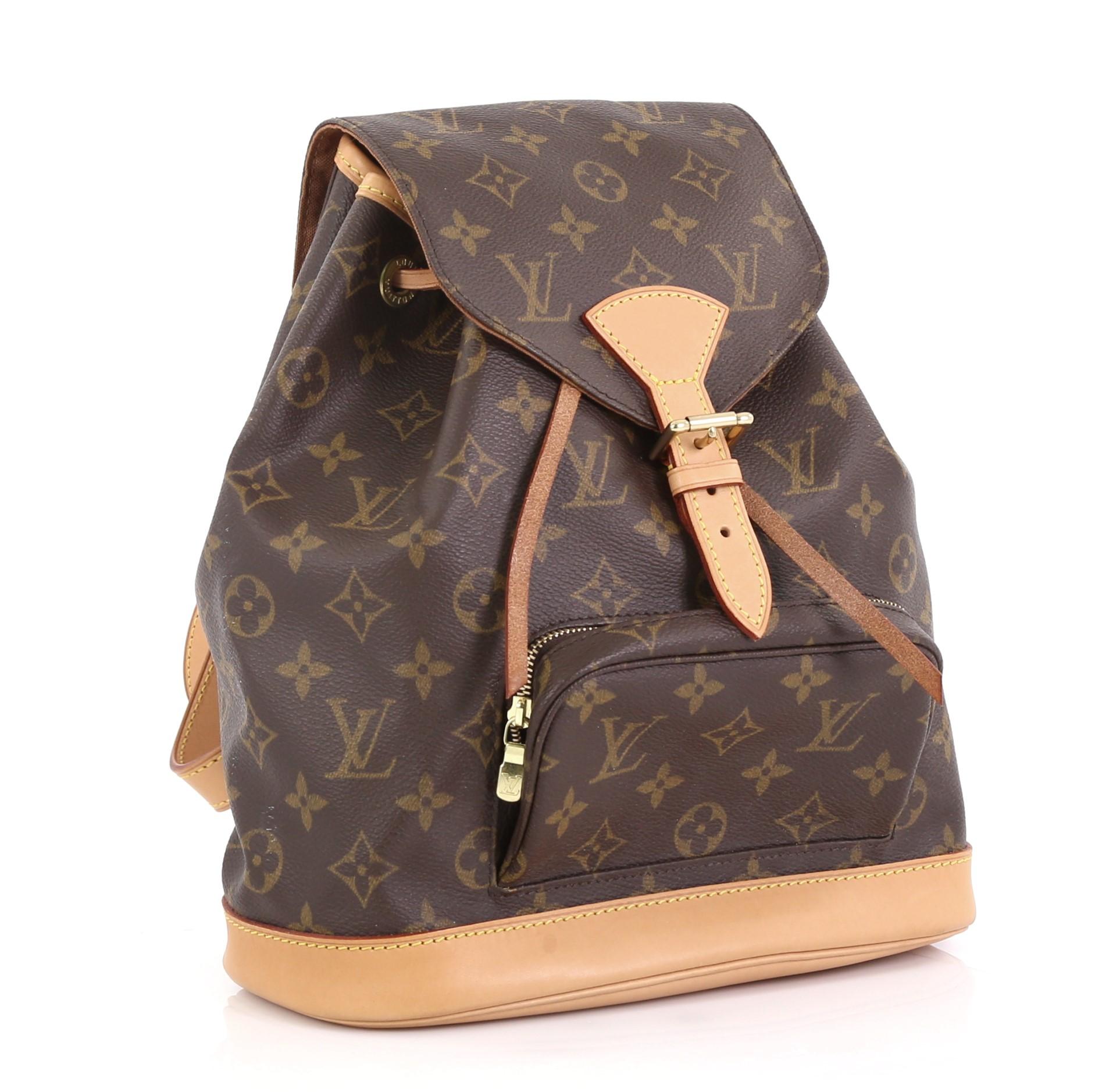 This Louis Vuitton Montsouris Backpack Monogram Canvas MM, crafted from brown monogram coated canvas, features adjustable shoulder straps, exterior front zip pocket, and gold-tone hardware. Its buckle and drawstring closure opens to a brown fabric