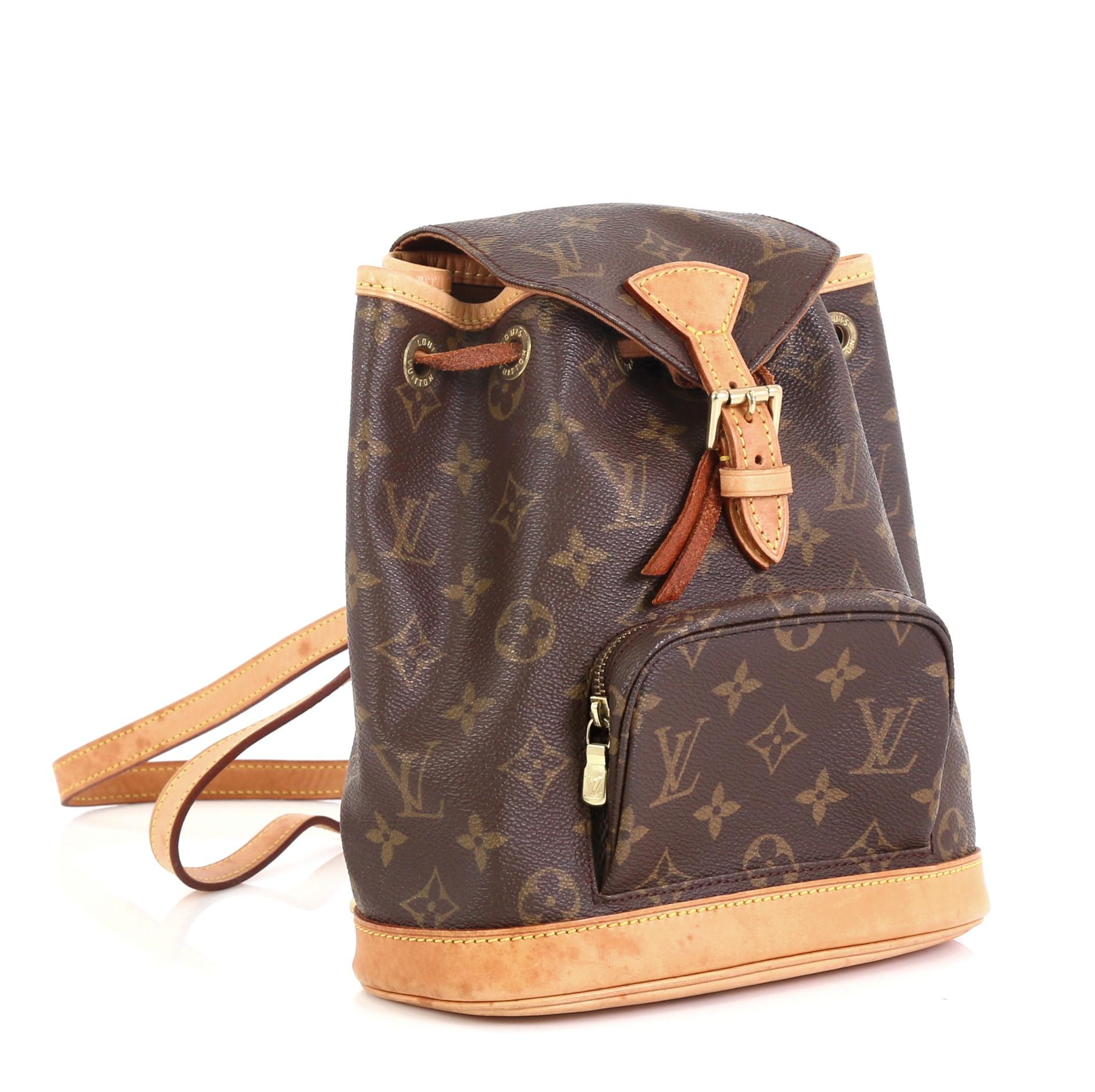 This Louis Vuitton Montsouris Backpack Monogram Canvas PM, crafted from brown monogram coated canvas, features adjustable shoulder straps, exterior front zip pocket, top flap with buckle, and gold-tone hardware. Its drawstring closure opens to a
