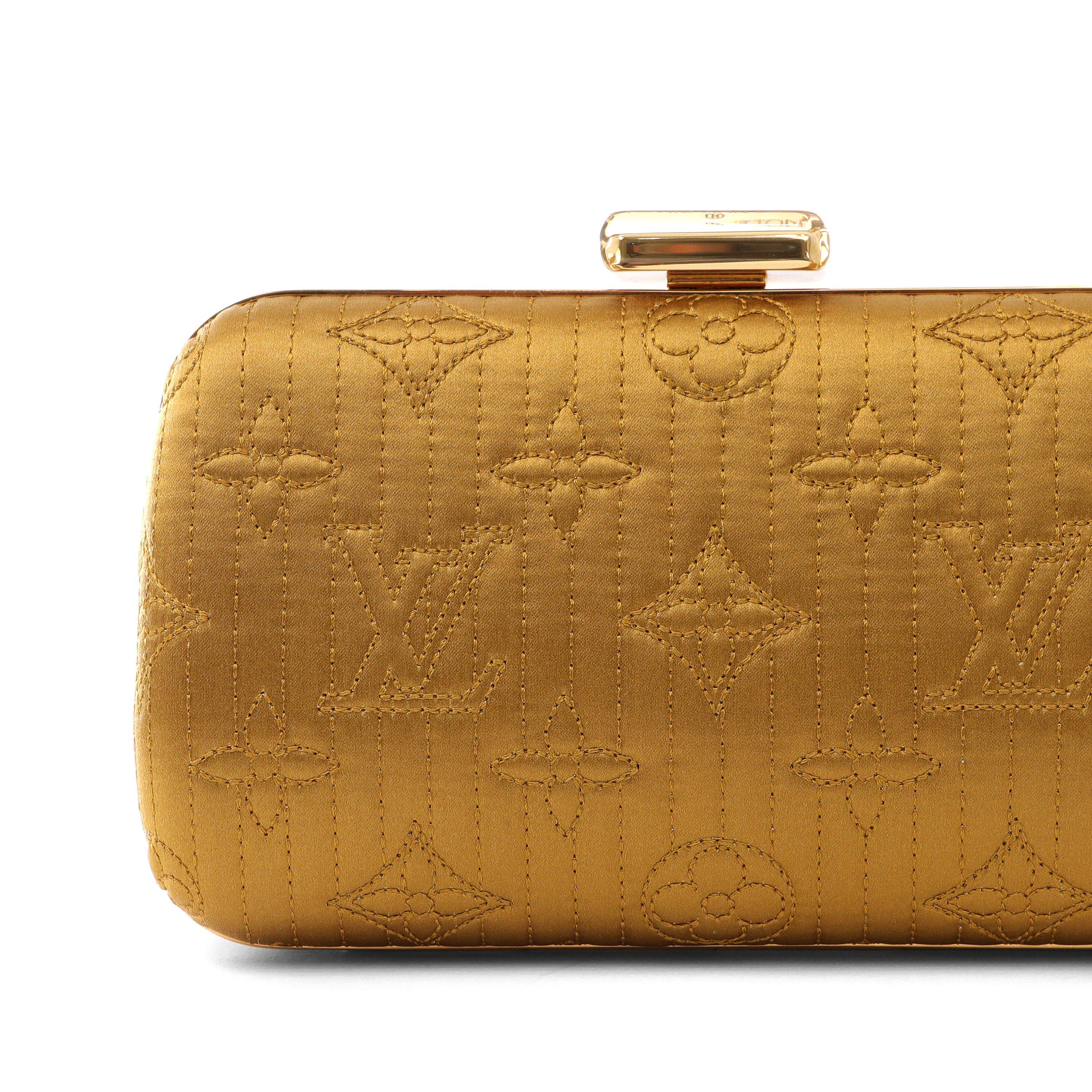 This authentic Louis Vuitton Mustard Monogram Satin Minaudiere is in pristine condition.  May be carried as a clutch or with an optional crossbody gold chain strap.  Golden hued moutard satin is quilted with signature Louis Vuitton monogram.  Press