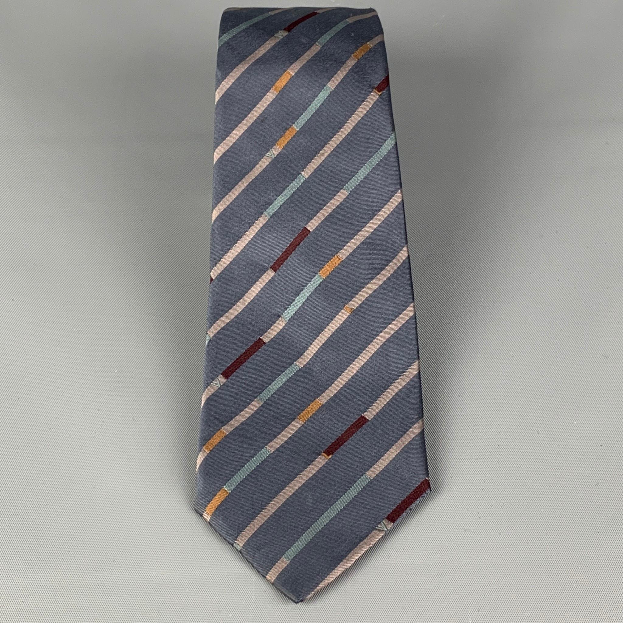LOUIS VUITTON neck tie comes in a multi-color diagonal stripe silk. Made in Italy. 

Very Good Pre-Owned Condition.

Measurements:

Width: 2.75 in. 