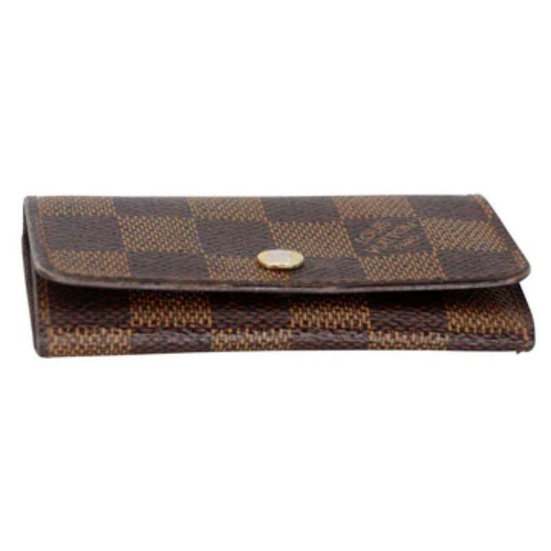 Louis Vuitton Multicles 6 Key Holder Monogram Damier Canvas Wallet LV-0817N-0006

This Louis Vuitton Damier Monogram Canvas Multicles 6-Key Holder will be your new favorite accessory. It holds six keys on shiny brass hooks. An ideal accessory to