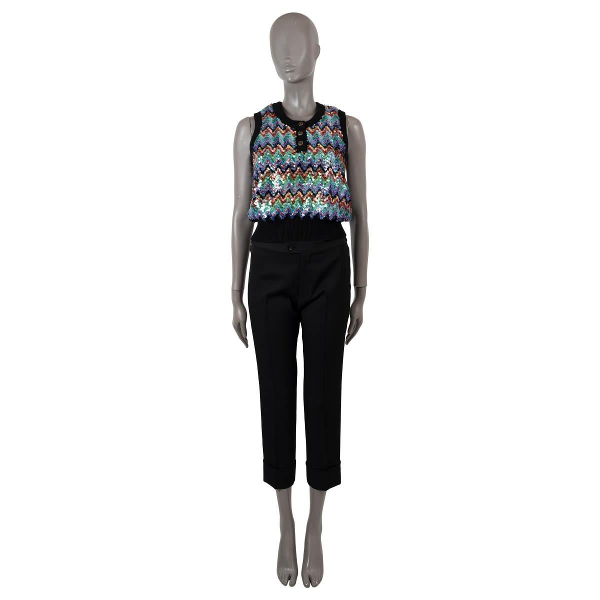 100% authentic Louis Vuitton zigzag sweater vest in black wool (93%), polyamide (6%) and elastane (1%) and multicolor sequins. Features a henley scoop neck, rib knit neck, armholes and hem. Lined in silk (with 9% elastane). Has been worn and is in