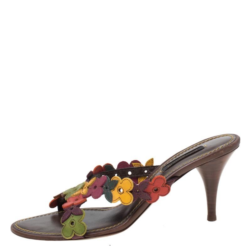 These multicolor sandals from Louis Vuitton are the perfect blend of elegance and poise. The slip-on style sandals have been crafted from leather and feature comfortable insoles. The sandals are complete with the brand's signature flowers on the