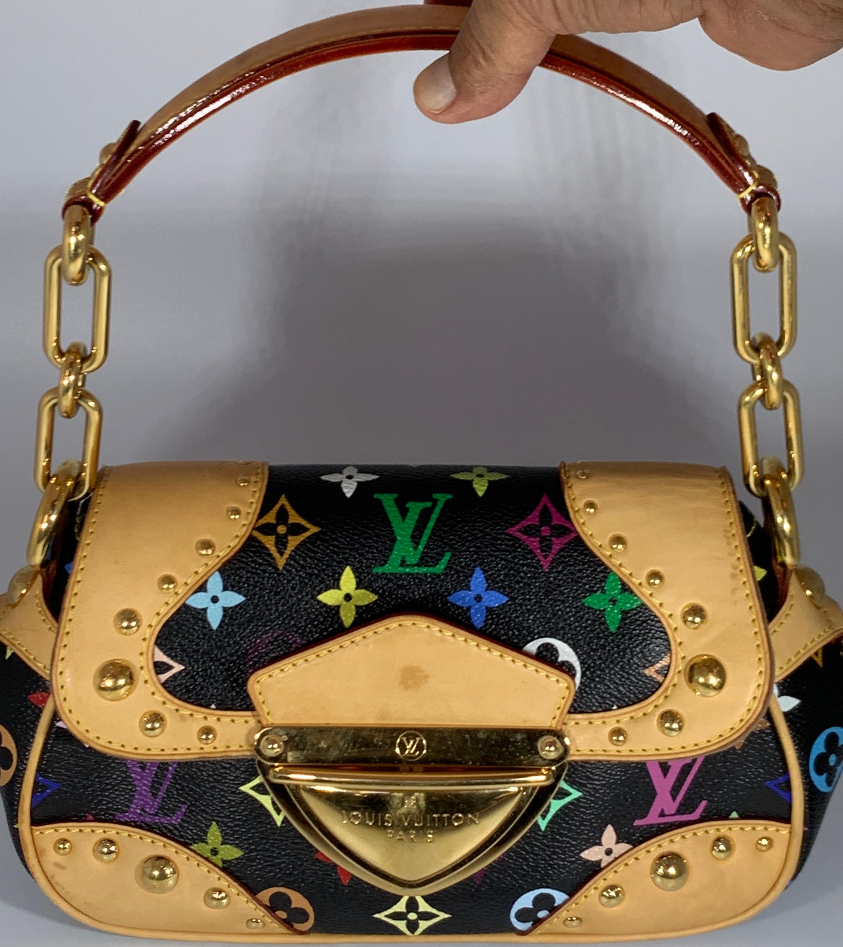 The Louis Vuitton Monogram Multicolore Marilyn Bag is truly a stunning piece. It features a sleek design that will hold all your girly essentials in style. With its bold push-lock closure, beautiful studs and exquisite details, you won't want to