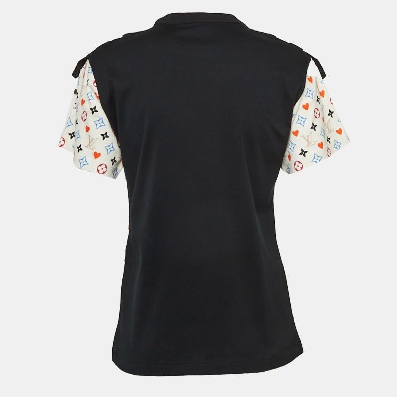 Embrace vibrant luxury with the Louis Vuitton t-shirt. Crafted with meticulous attention to detail, this shirt features the iconic LV monogram in a playful multicolor palette. Its contrasting back adds a dynamic edge to this statement piece, perfect