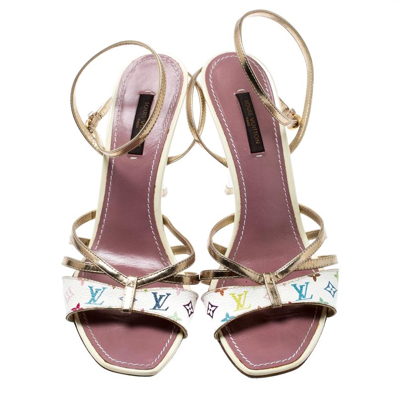 A perfect blend of comfort and style, these open toe sandals are just what you need for an evening out. These are crafted from monogram coated canvas and leather and are styled with ankle straps, buckle closure and high heels. This classic pair by