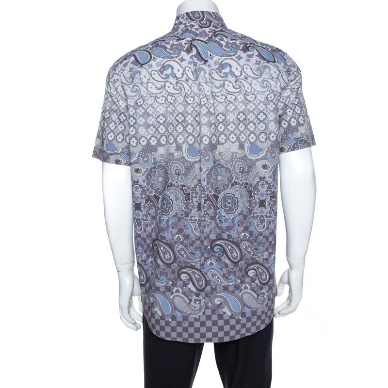 This stunning shirt from Louis Vuitton is a closet must-have. Crafted from 100% cotton, it features a lovely print in multiple hues throughout. The shirt features short sleeves, a simple collar and button front closure. It exudes style and is a