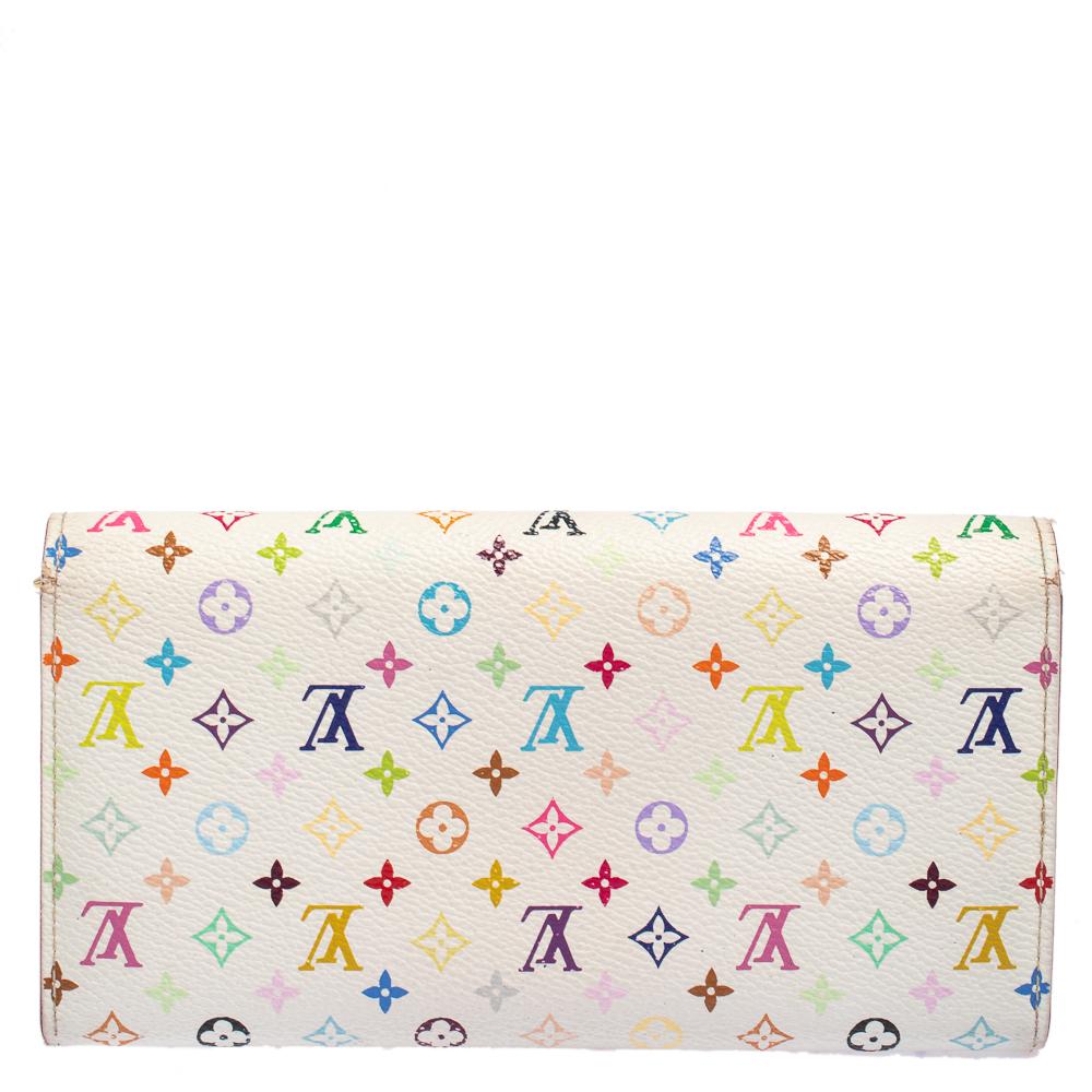 One of the most famous wallets by Louis Vuitton is the Sarah. This one here comes made from the signature Multicolore Monogram canvas and the engraved button on the flap opens to an interior with multiple card slots, a slip pocket, and a zip pocket.