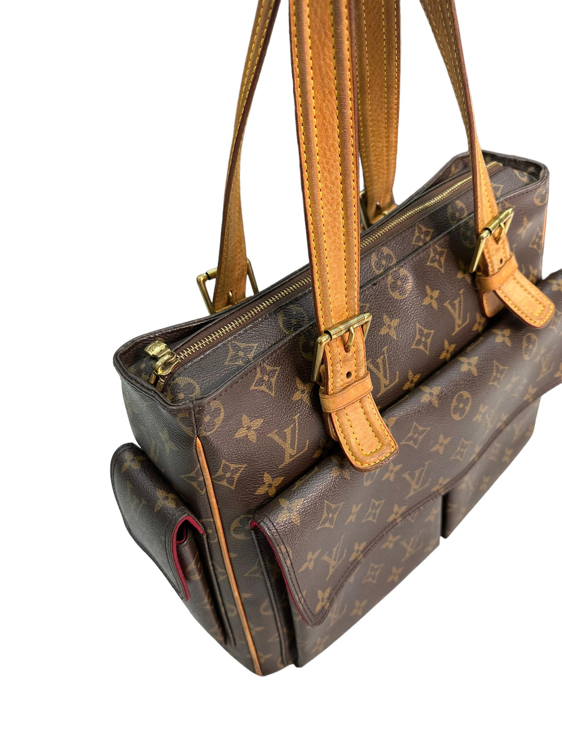Louis Vuitton signed bag, Multipli Cite model, size GM, made of brown canvas in the classic Monogram pattern with cowhide inserts and golden hardware. Equipped with an upper zip closure, a side pocket with magnetic button closure, and two front