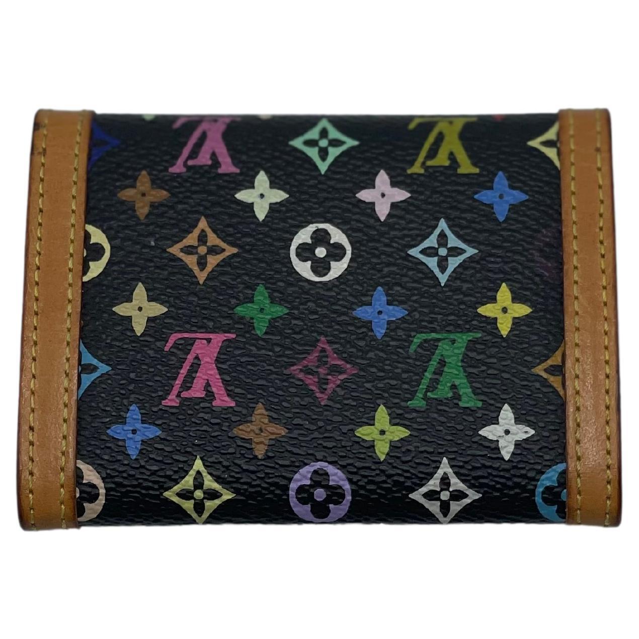 From the historic partnership between Murakami and Louis Vuitton, this Porte Monnaie Plat card holder is constructed from coated canvas with Murakami's eye-catching Multicolore design, natural Vachetta leather trim, and gold-tone brass hardware.