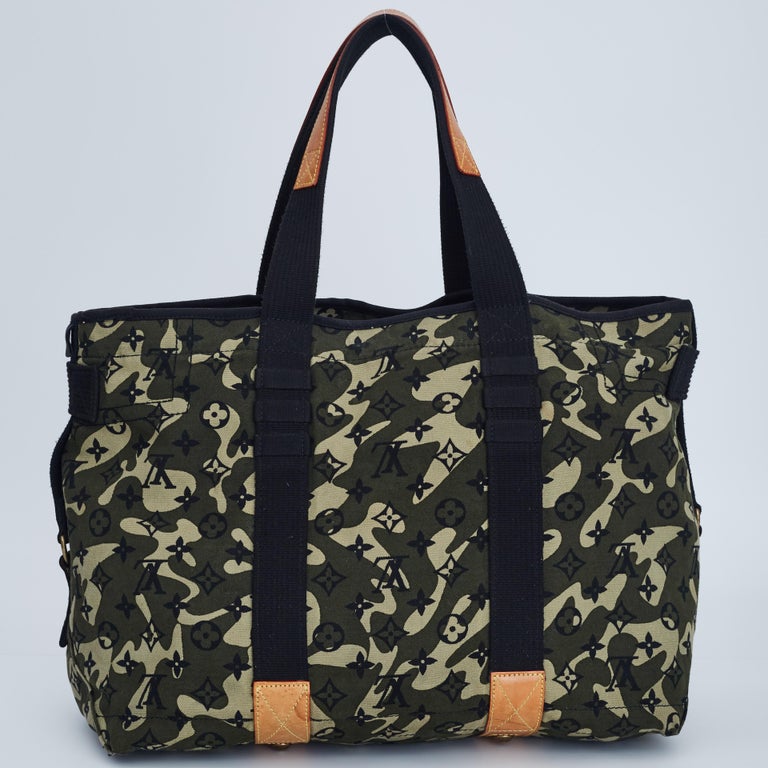 Louis Vuitton and Takashi Murakami collab piece. Rare tote bag from the famous Monogramouflage collection. Featuring dual black top top handles, logo charm, top zip fastening, an open main compartment with patch pockets and gold-tone