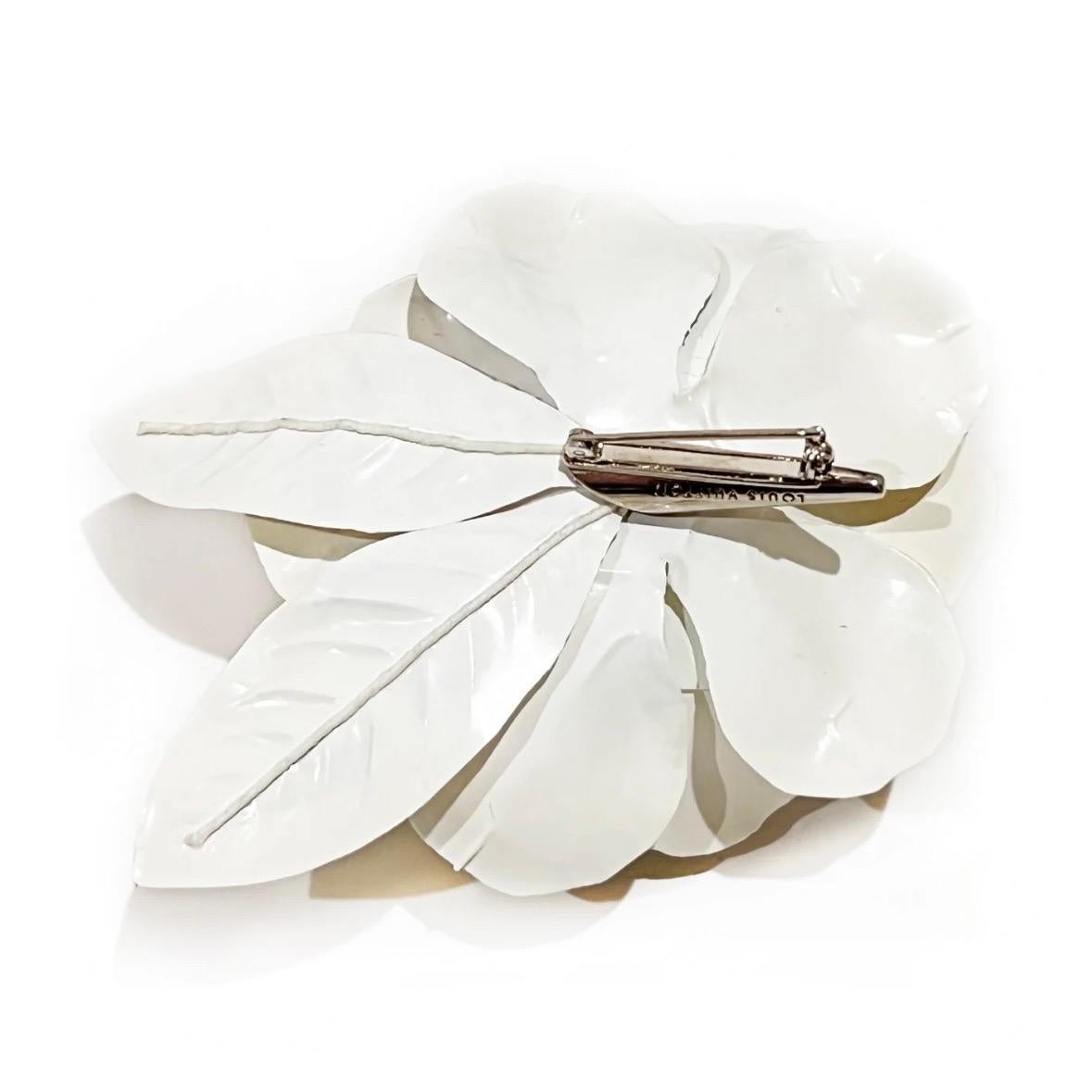 Multicolor monogram flower brooch by Takashi Murakami for Louis Vuitton
2003
Ivory laminated plastic 
Multicolored LV monogram print throughout 
Silver-metal pin closure on the back 
Condition: Great, some small bends in a few flower petals. 