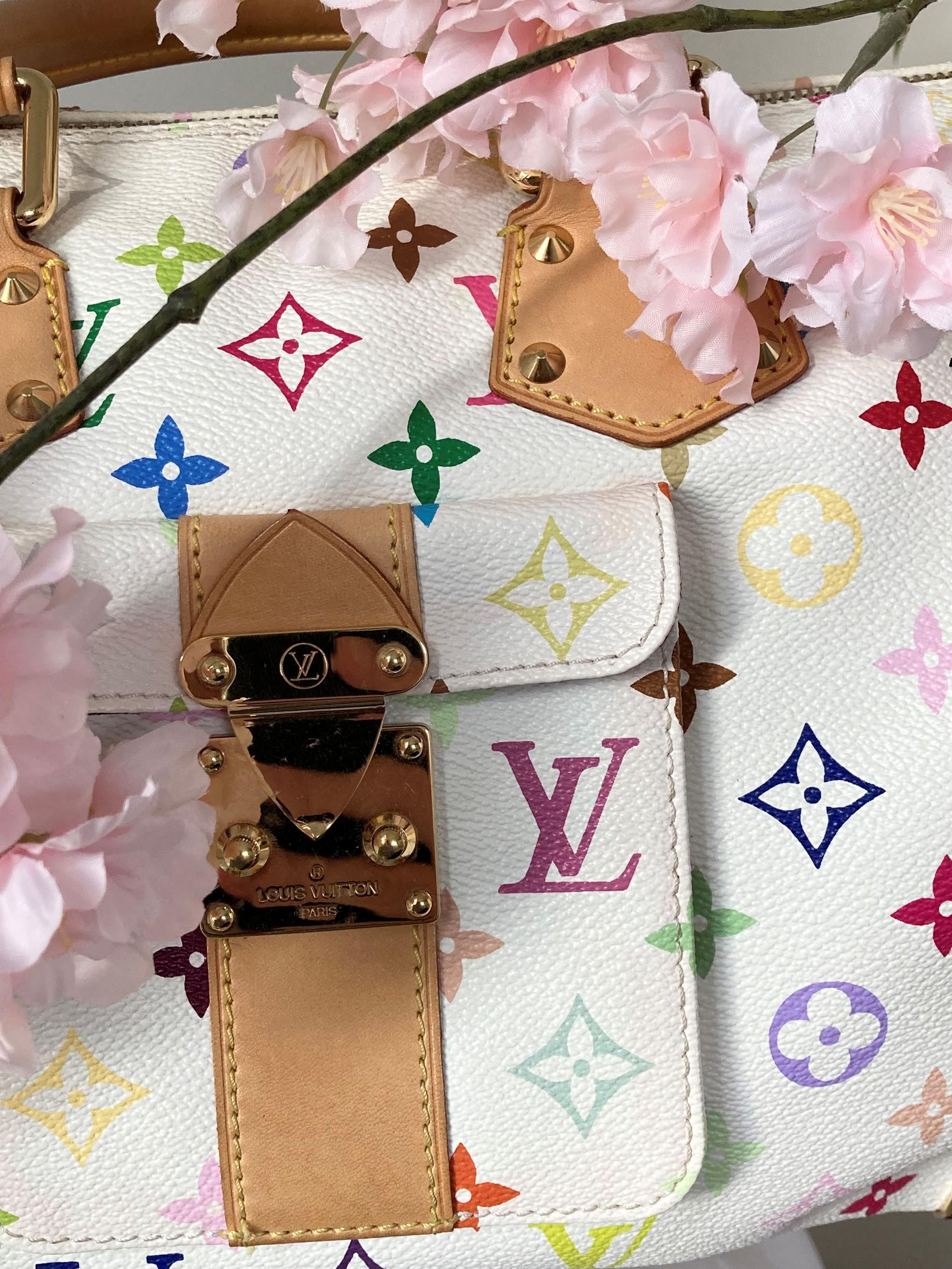 From our private collection, we offer this collectors item which is no longer being made by Louis Vuitton; the Louis Vuitton multicolor monogram speedy 30 handbag. The bag comes with its original keys, clochette and dustbag. It is extremely hard to