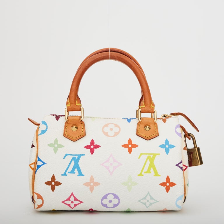 The Japanese pop artist Takashi Murakami worked to revamp the traditional monogram toile and give it a splash of colour. He created a new vibrant canvas with 33 colours on white canvas as seen in this Keepall bag.

This made is made of white coated