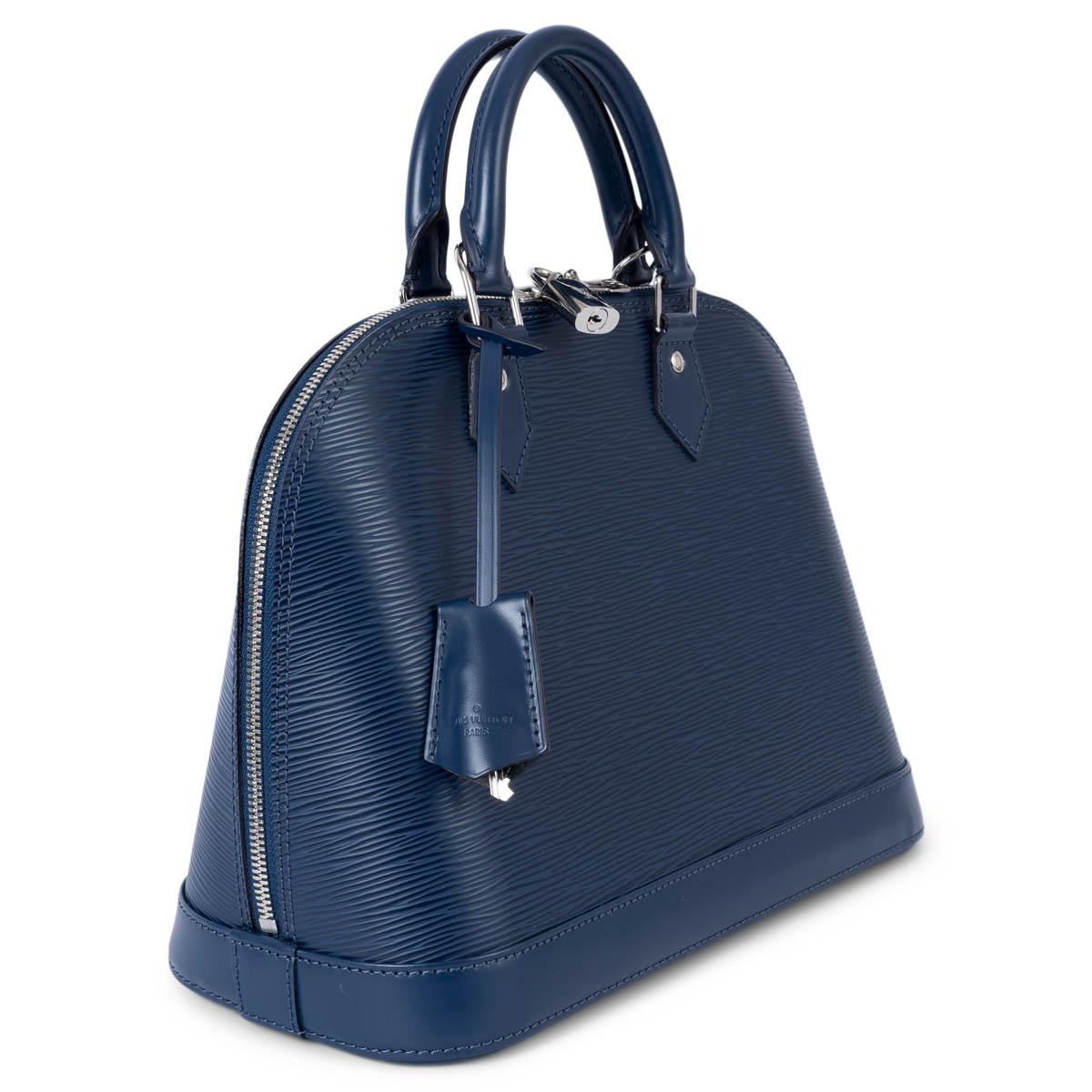 100% authentic Louis Vuitton Alma PM handbag in Myrtille (navy blue) Epi leather featuring silver-tone hardware. Opens with a double zipper on top and is lined in navy blue alcantara with two open pockets against the back. The design features
