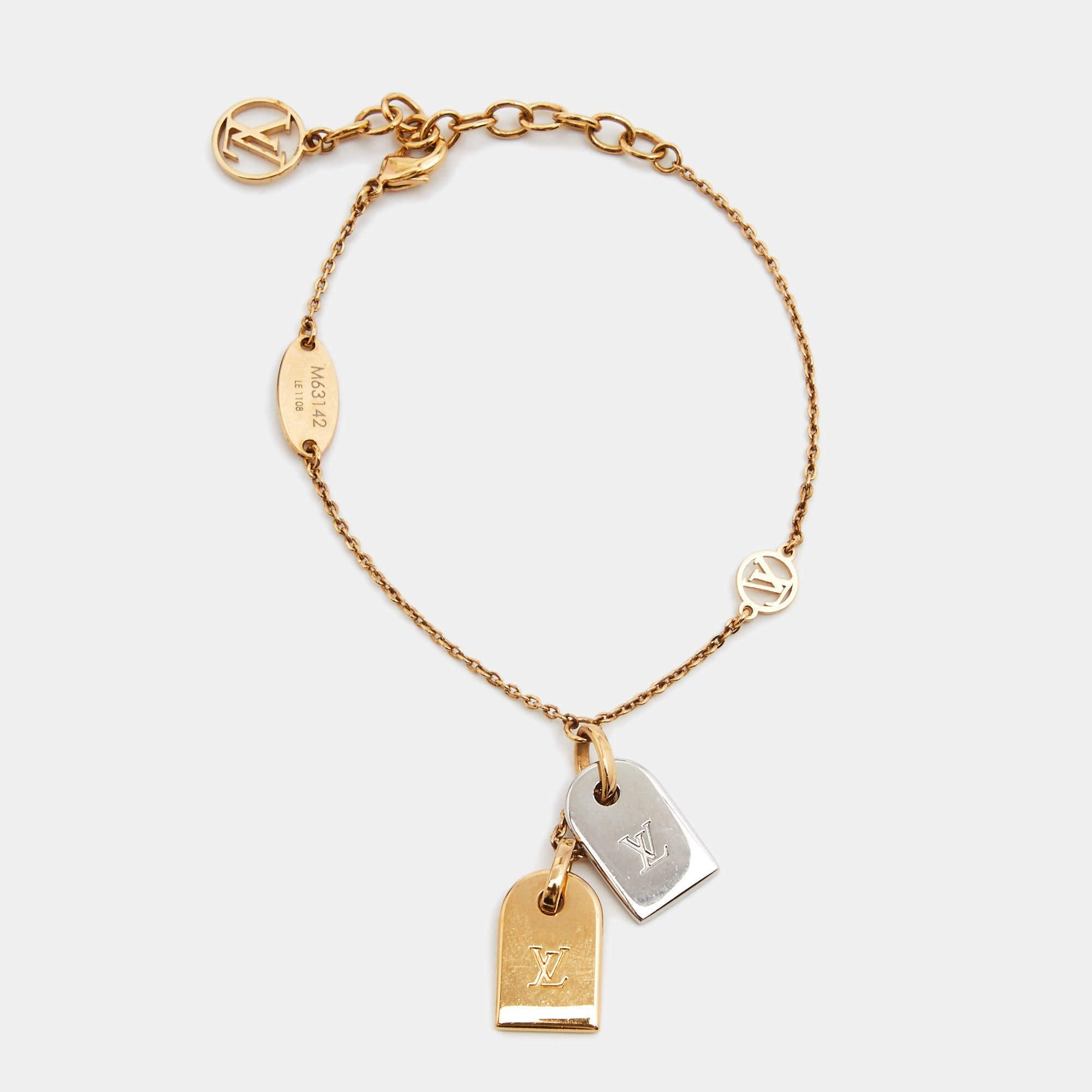 This Nanogram bracelet is packed with Louis Vuitton's famous elements, from the iconic initials to the timeless monogram pattern. The bracelet is crafted from two-tone metal and the chain holds two name tags.

Includes: Original Dustbag, Original Box