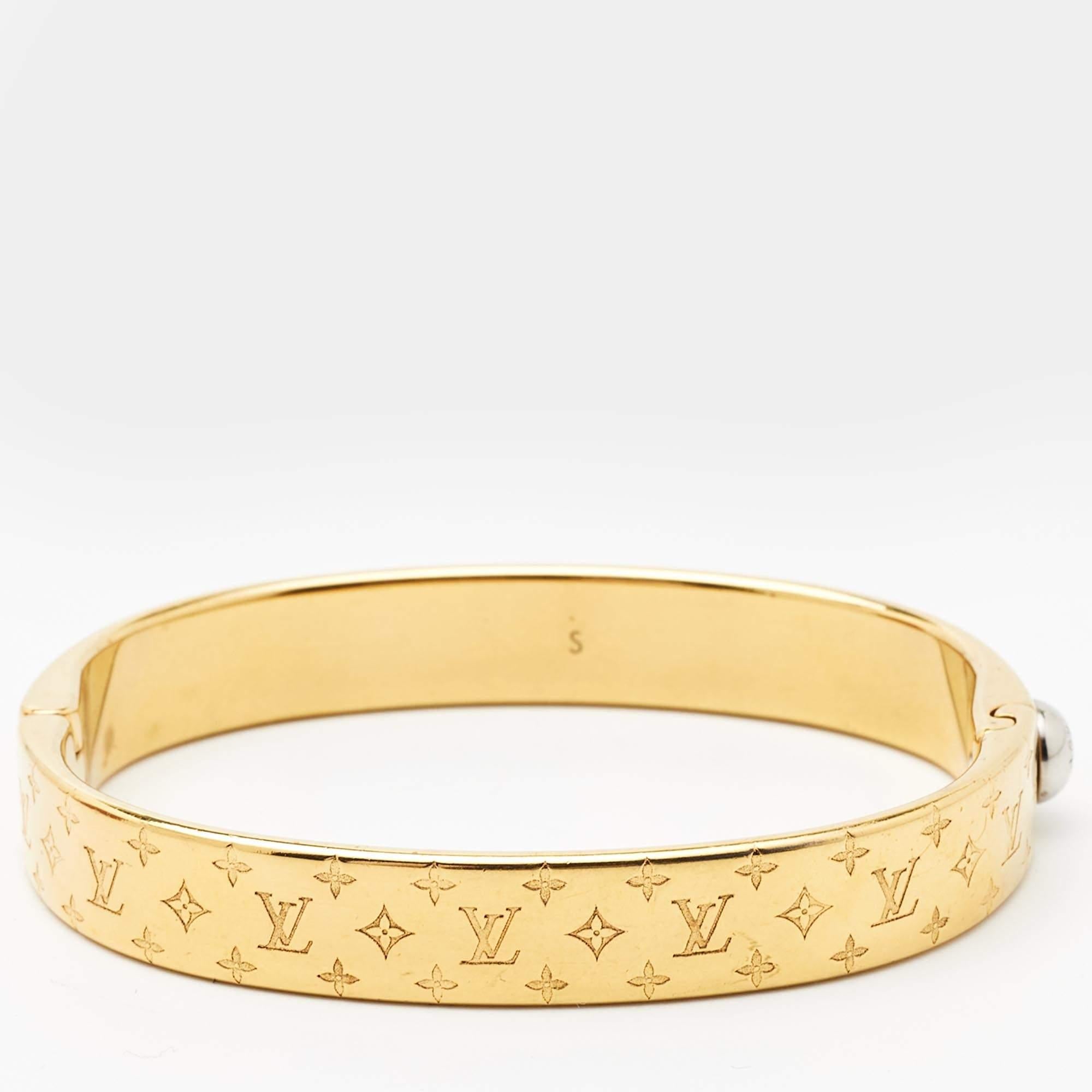 Create an elegant, timeless, and classic addition to both casual and even special events with this beautiful Louis Vuitton Nanogram bracelet. Constructed in two-tone metal, this bracelet features the iconic Monogram all over.

Includes: Original