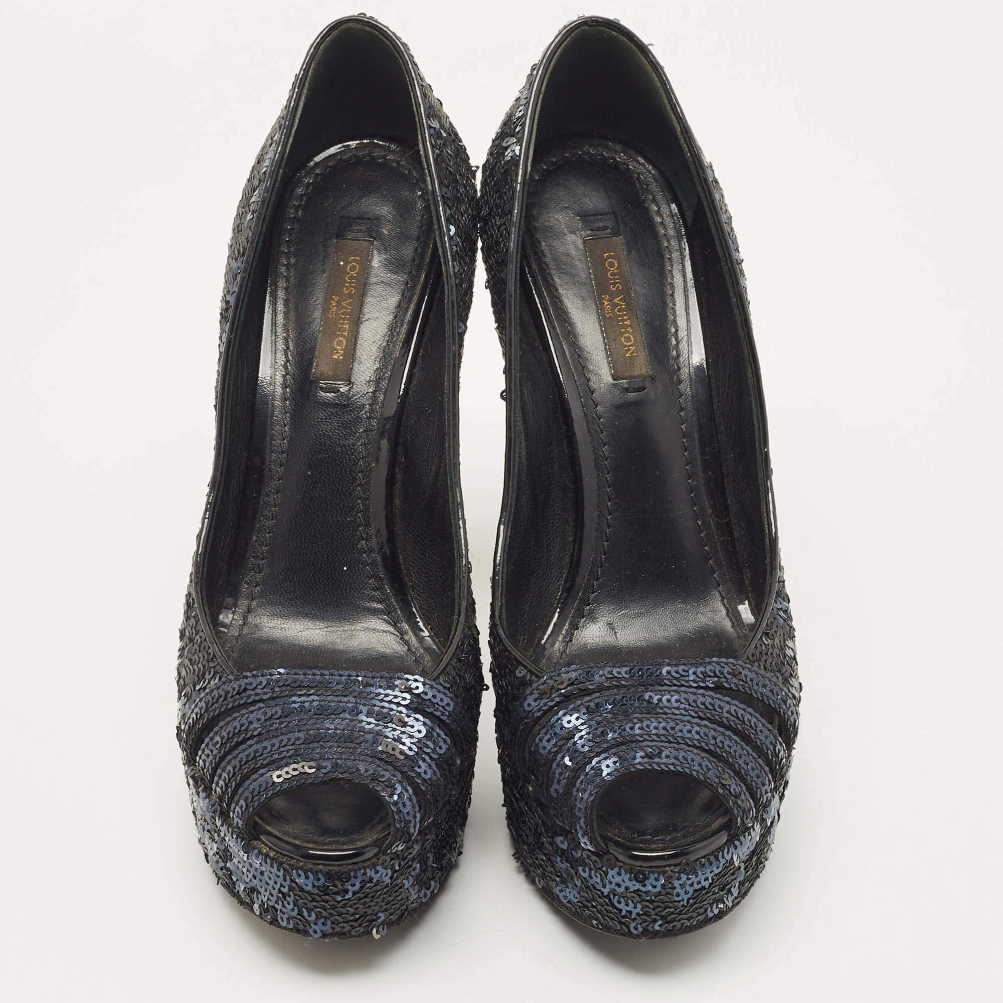 Feel the admiring glances coming your way whenever you sashay out in this pair of gorgeous pumps from Louis Vuitton. They've been embellished with sequins and lined with leather on the insoles. The pumps carry peep toes and are beautifully balanced