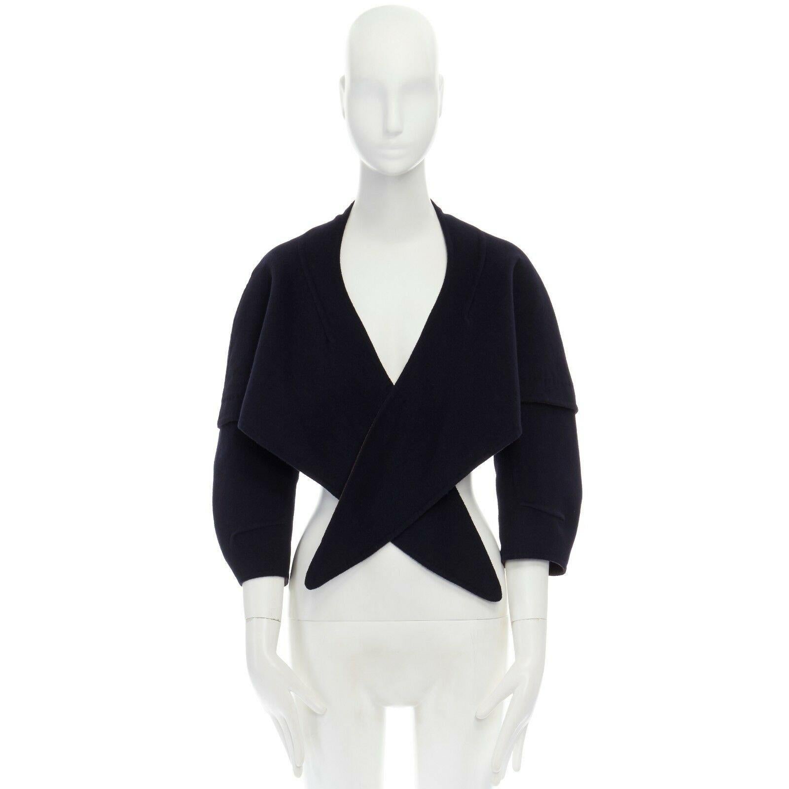 LOUIS VUITTON navy blue double faced wool blend tie front capelet shawl FR36 S 
Reference: TGAS/A02527 
Brand: Louis Vuitton 
Material: Wool 
Color: Blue 
Pattern: Solid 
Extra Detail: Wool, angora, cashgora. Navy blue. Double faced. Brown lining.
