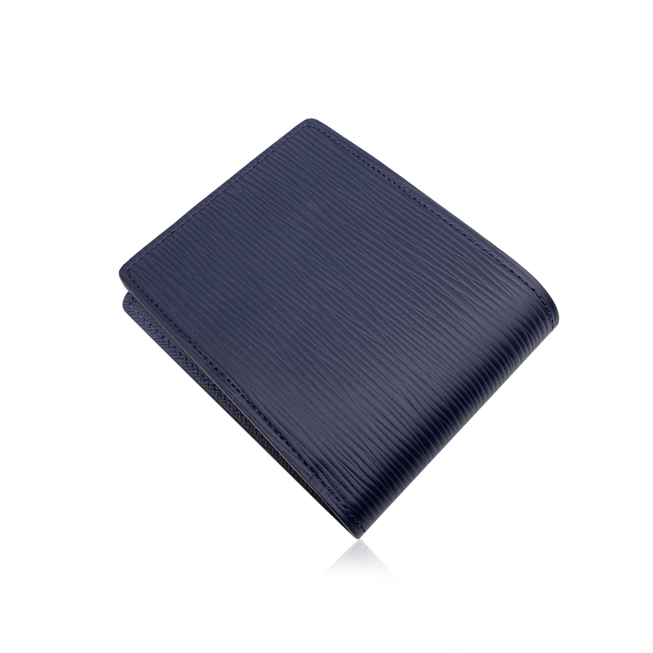 This beautiful wallet will come with a Certificate of Authenticity provided by Entrupy. The certificate will be provided at no further cost Louis Vuitton navy blue epi leather Multiple Bifold Wallet Credit Card Holder. Bifold design. 2 bill