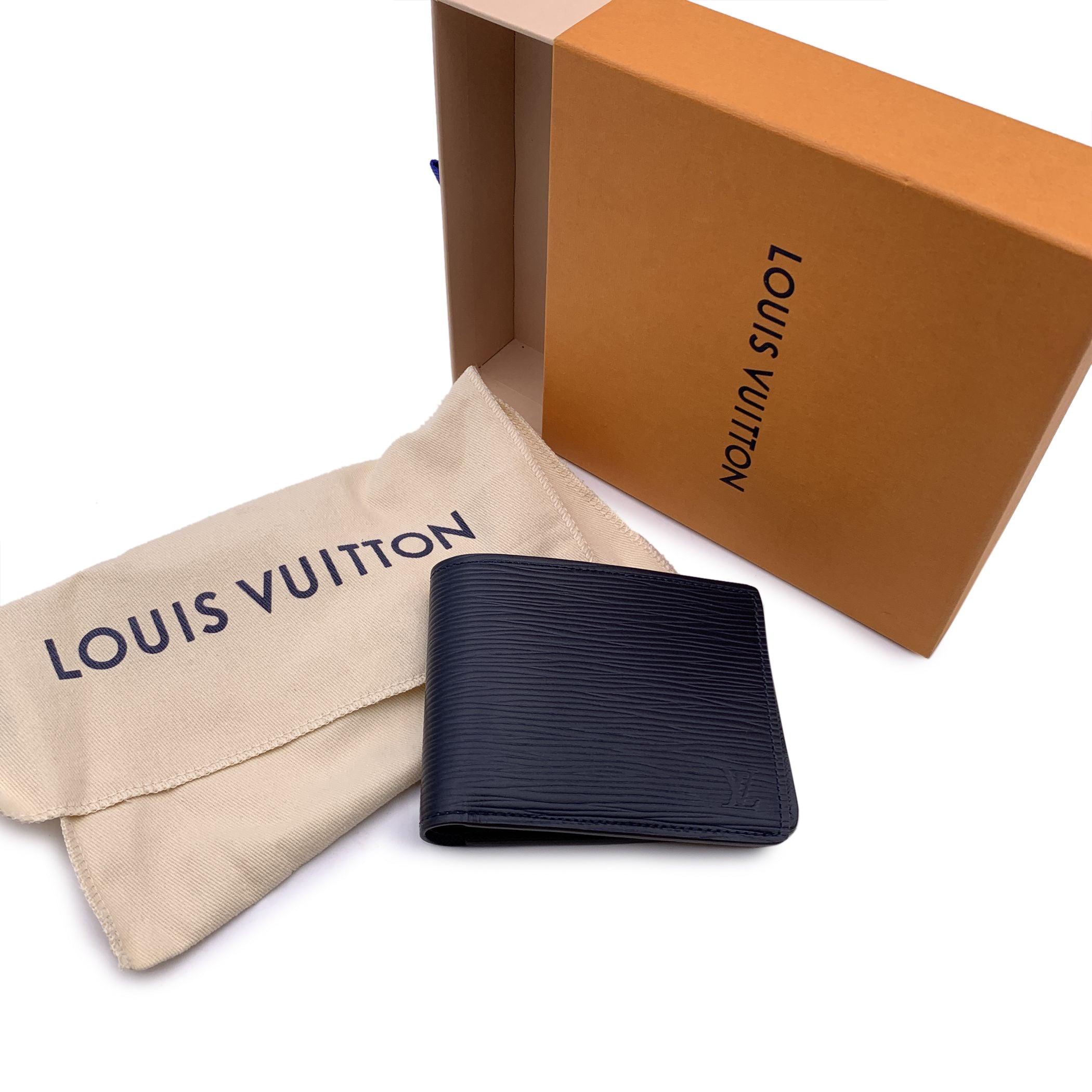 This beautiful wallet will come with a Certificate of Authenticity provided by Entrupy. The certificate will be provided at no further cost Louis Vuitton navy blue epi leather Multiple Bifold Wallet Credit Card Holder. Bifold design. 2 bill