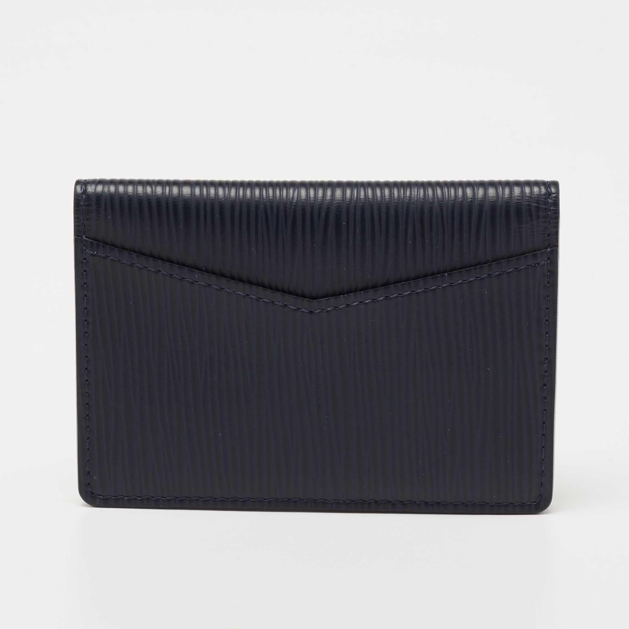 This Louis Vuitton pocket organiser is compact enough to be carried effortlessly. Created from the Epi leather, it features a brand signature on the front, a slip pocket at the back, and a compartmentalized interior.

Includes: Original Box,