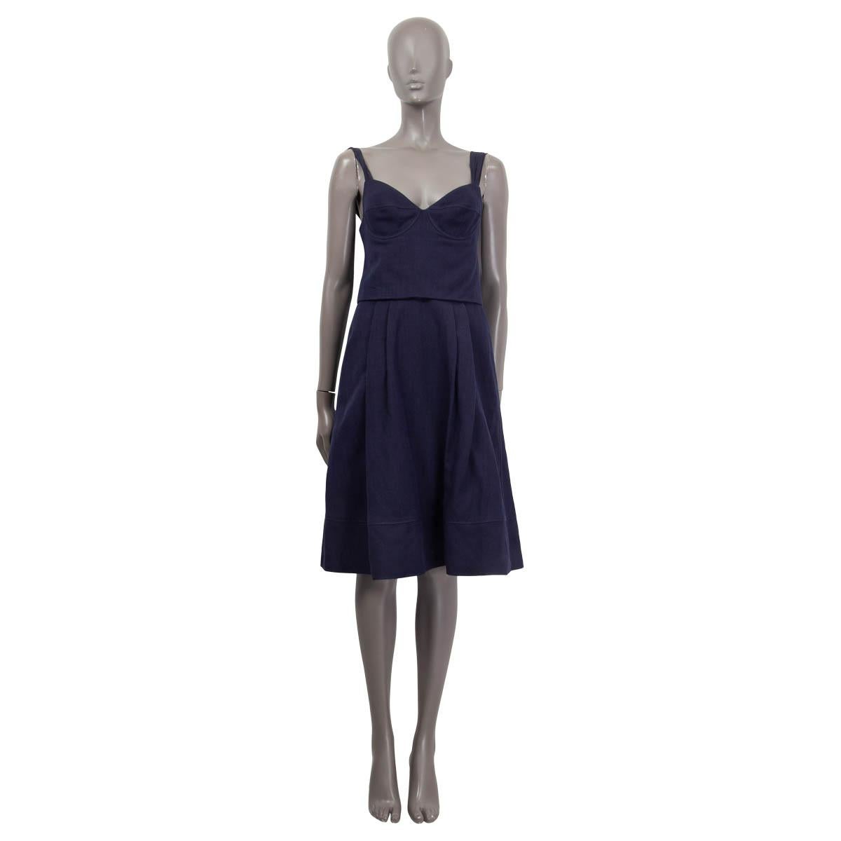 100% authentic Louis Vuitton paneled bustier dress in navy blue linen (50%) and silk (50%). Features an a-line fit and chiffon silk straps. Corsage lined in blue silk (100%) and the skirt lined in white linen (87%) and silk (13%). Has been worn and