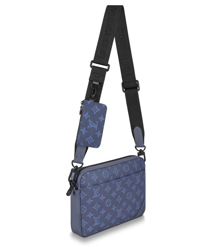 A modern cross-body bag with a a detachable coin purse on the strap. Small coin purse. Front zipped pocket. Inside flat pocket. Strap: non-removable, adjustable. Strap drop: 81 cm. Strap drop max: 123 cm.
