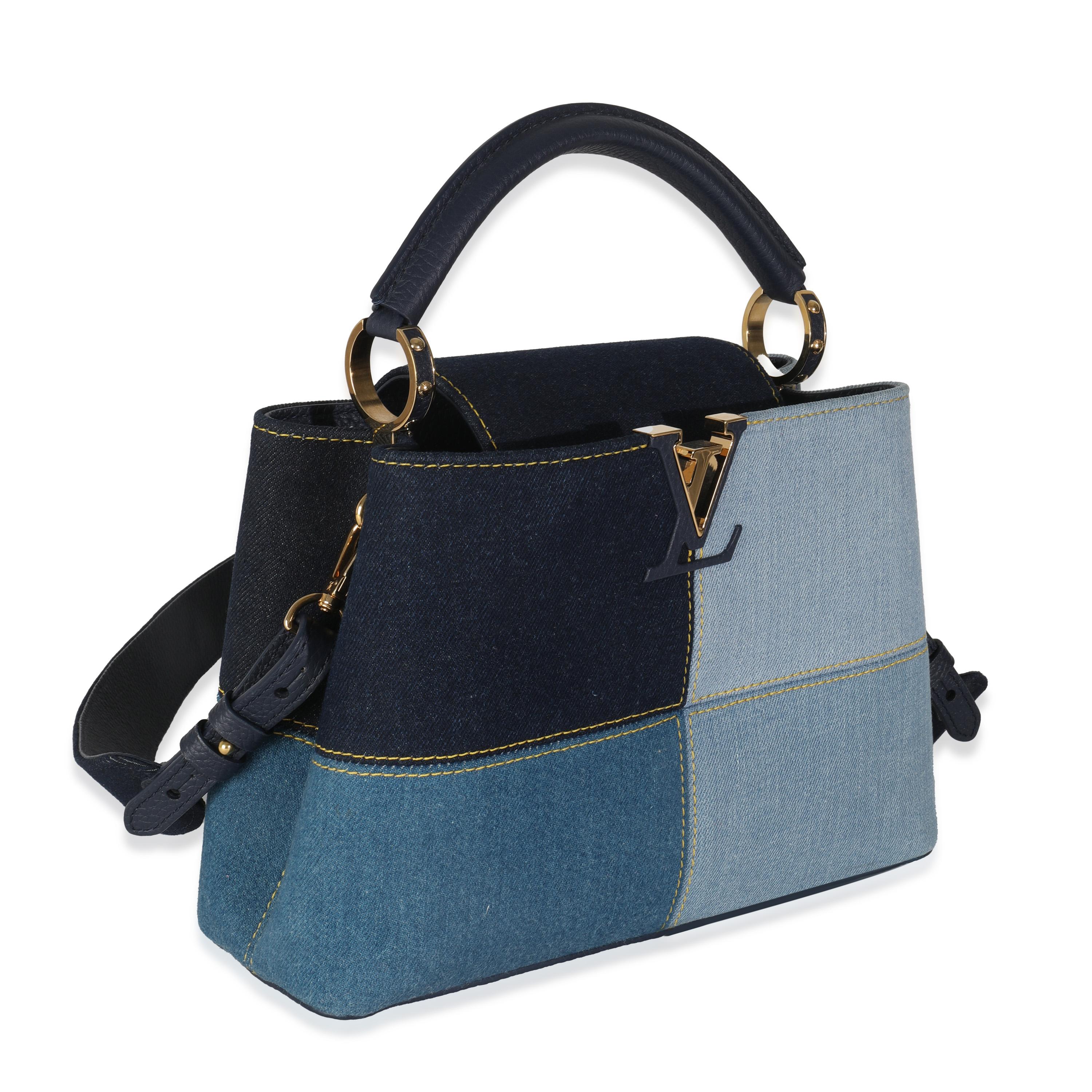 Listing Title: Louis Vuitton Navy Blue Patchwork Denim Capucines BB
SKU: Z144664
Condition: Pre-owned 
Condition Description: The Louis Vuitton Capucines bag was created with the brand's house codes in mind. Encapsulating the maison's DNA, the
