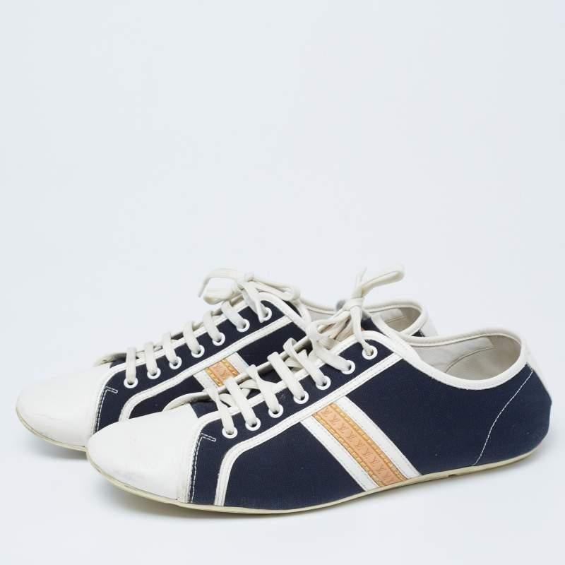 Coming in a classic low-top silhouette, these Louis Vuitton sneakers are a seamless combination of luxury, comfort, and style. They are made from canvas and leather in dual shades. These sneakers are designed with logo details, laced-up vamps, and