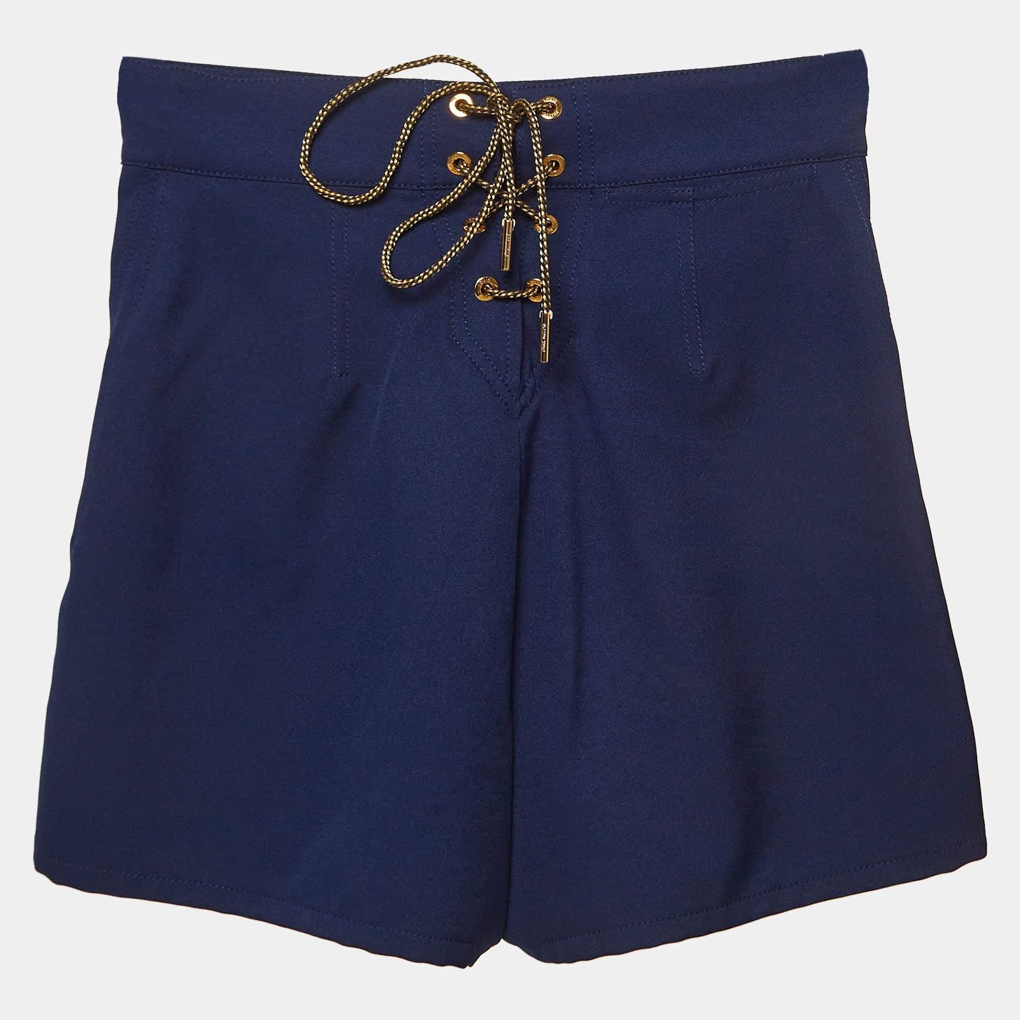 The Louis Vuitton shorts are a stylish and versatile addition to your wardrobe. Made from high quality fabric these shorts feature contrasting button detailing along the front for added visual interest. With a comfortable fit and a classic design