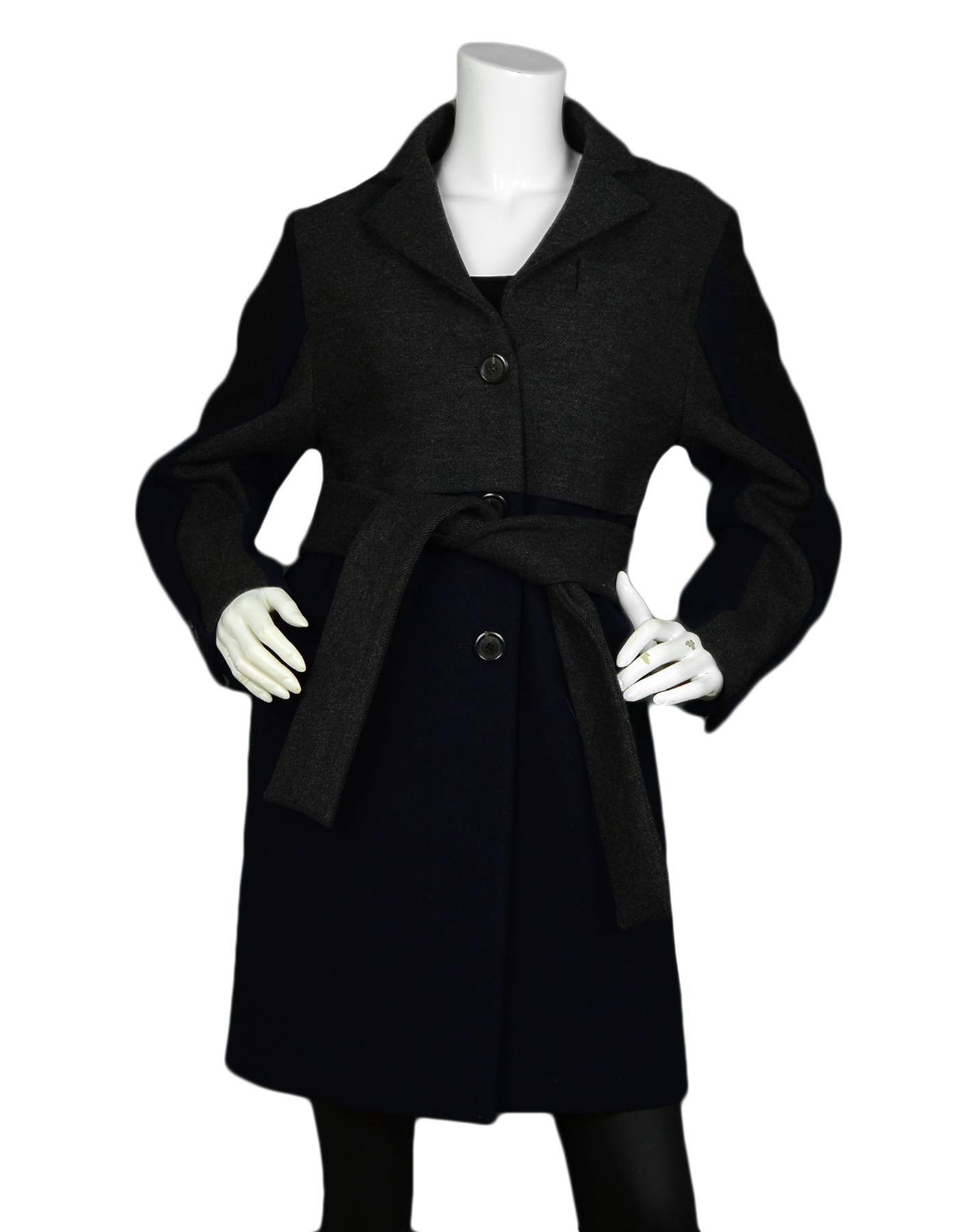 Louis Vuitton Navy Grey Wool Coat with Belt sz 36

Made In: France
Color: Navy, Grey
Materials: 100% Wool
Lining: 100% Silk
Opening/Closure: Front button down
Overall Condition: Excellent pre-owned condition
Includes: Garment Bag, Hanger

Tag Size: