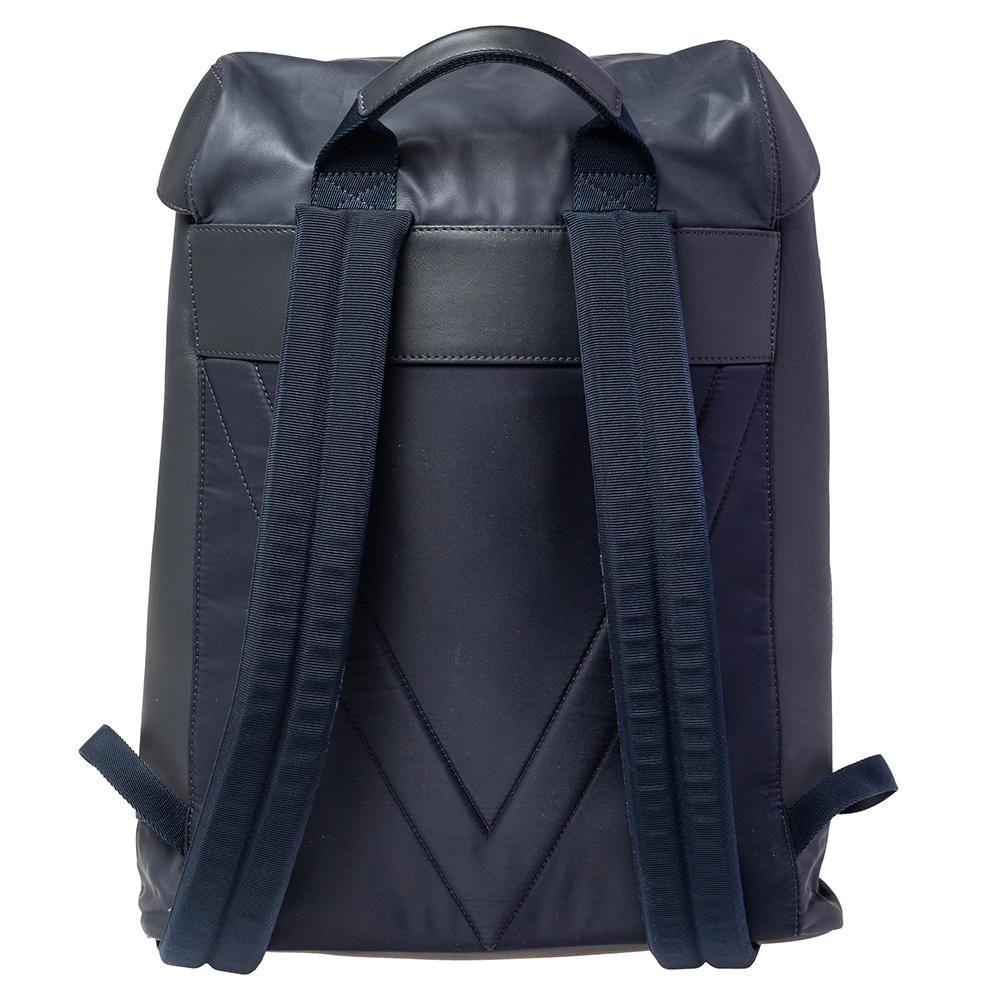 This V Line Pulse backpack from Louis Vuitton is perfect for storing all your things in one place. Made from blue nylon and leather, this lightweight backpack is your ultimate travel companion. It has a drawstring and a push-lock closure at the top