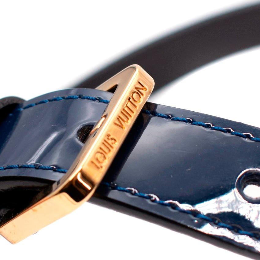 Louis Vuitton Navy Patent Leather Narrow Belt with Gold-Tone Hardware
 

 - Narrow navy blue patent belt with gold-tone metal hinges at either side and front buckle
 - Buckle features engraved branding, leather tip features debossed logo
 


