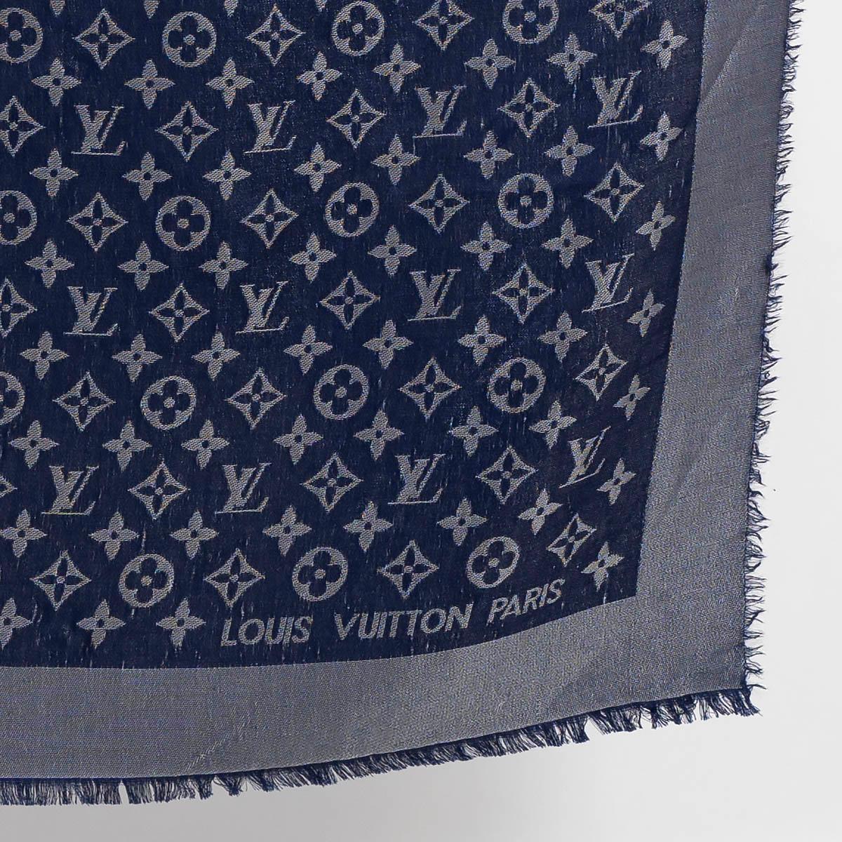 100% authentic Louis Vuitton Monogram Shine shawl in navy blue silk (49%), viscose (24%), wool (18%) and polyester (9%). Has been worn and shows a few pulled threads. Overall in good condition. 

Measurements
Model	M70805
Width	142cm