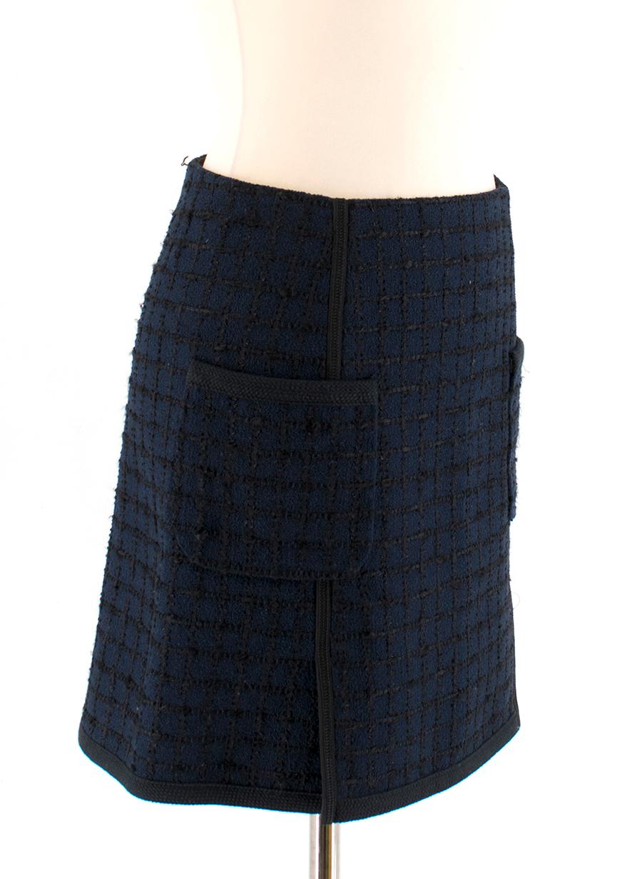 Louis Vuitton Navy Tweed Skirt

- Navy fabric with black detail
- Two vents in front
- Two pockets in front
- Zipper and button in good condition

Please note, these items are pre-owned and may show signs of being stored even when unworn and unused.