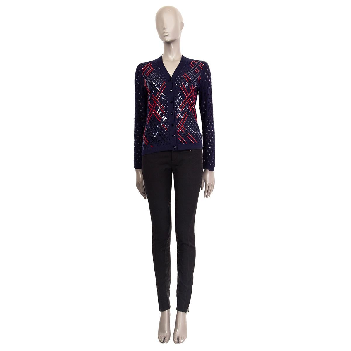 100% authentic Louis Vuitton button-front cardigan in navy blue wool (100%) with holes and embellished with coral red and midnight blue sequins. Has been worn and is in excellent condition.

Measurements
Tag Size	S
Size	S
Shoulder Width	36cm