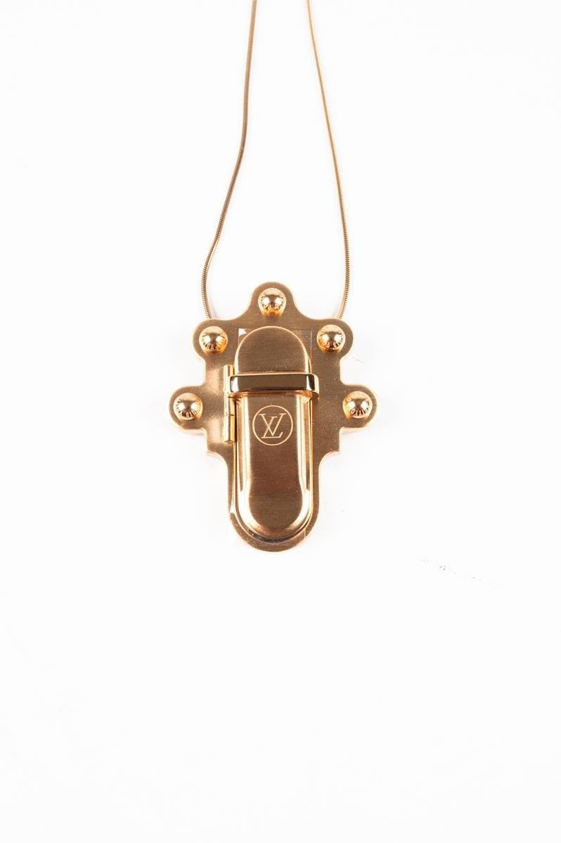Item for sale is 100% genuine Louis Vuitton Necklace Brooch Trunk Lock Men/Women Size One size S083
Color: Gold
(An actual color may a bit vary due to individual computer screen interpretation)
Material: Metal
Tag size: One size 
This necklace is