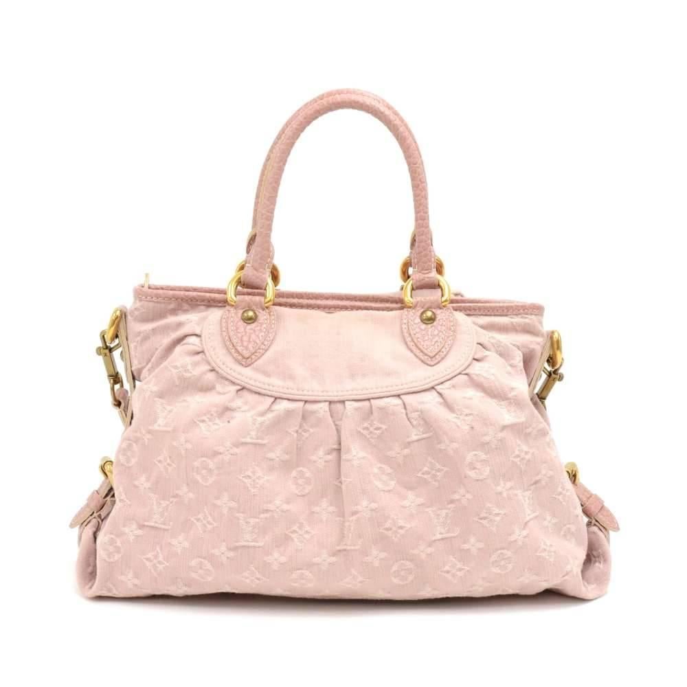 Louis Vuitton Neo Cabby bag in pink monogram denim with stylish pink pebbled leather details.  Has some brass buckle and leather belt details along the sides and the main access is secured with a zipper. Inside is lined with light pink alkantra