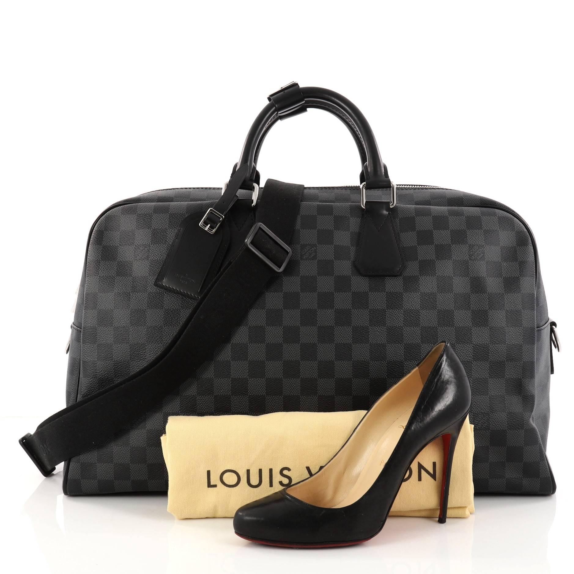 This authentic Louis Vuitton Neo Kendall Handbag Damier Graphite is a practical cabin-sized duffle with a contemporary and elegant design made for light travels. Crafted from luxurious black damier graphite coated canvas, this bag features