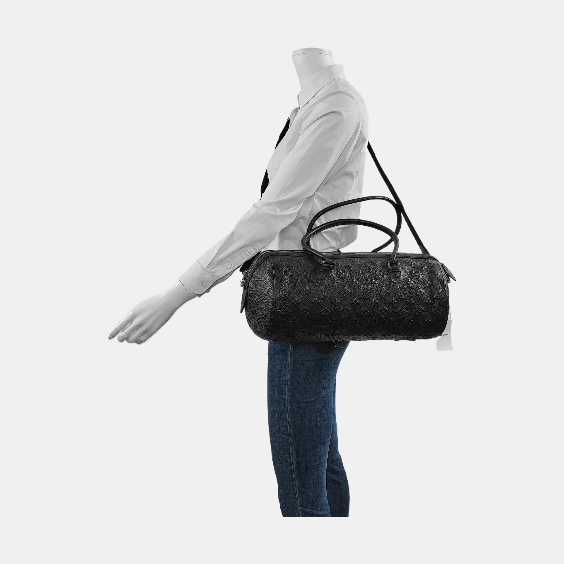 This Neo Papillon model, longer than the classic Papillon, is made from leather embossed with a 3D Louis Vuitton monogram. It features two slender, elongated top handles that double as shoulder straps. Originally designed in 2012, this vintage piece