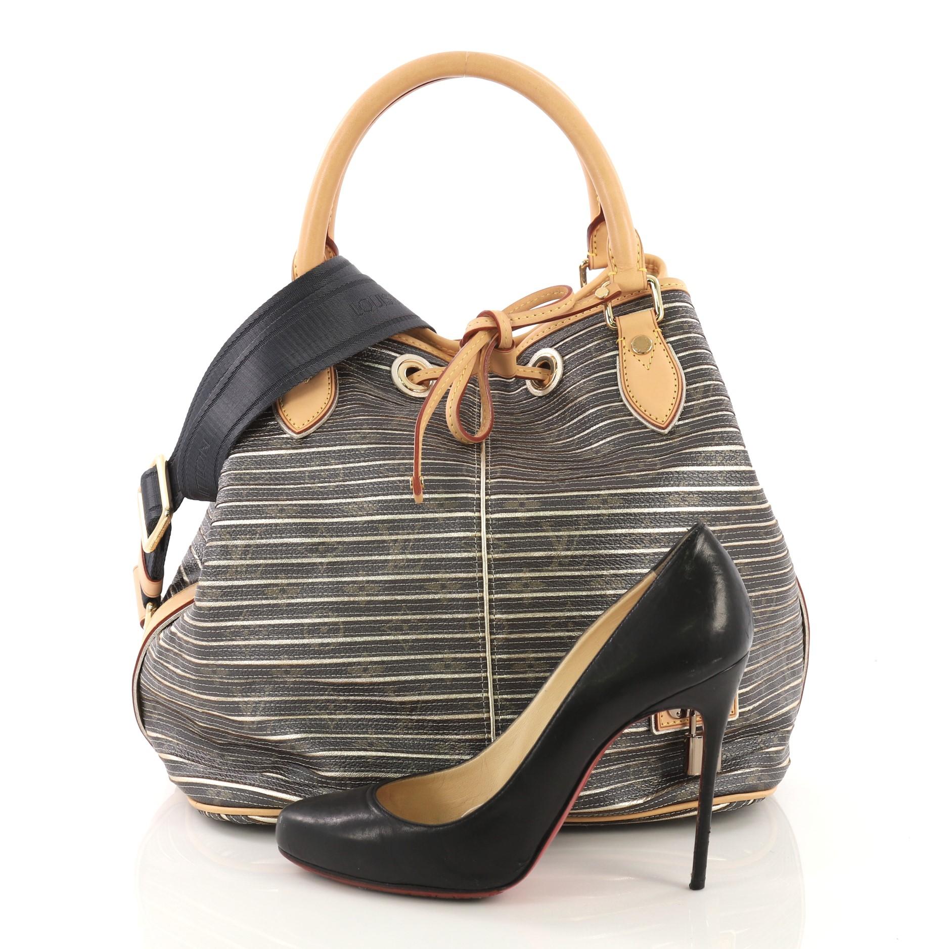 This Louis Vuitton Neo Shoulder Bag Limited Edition Monogram Eden, crafted from brown monogram canvas with metallic stripes, features dual rolled handles, cowhide leather trim, decorative LV lock, and gold-tone hardware. Its drawstring closure opens