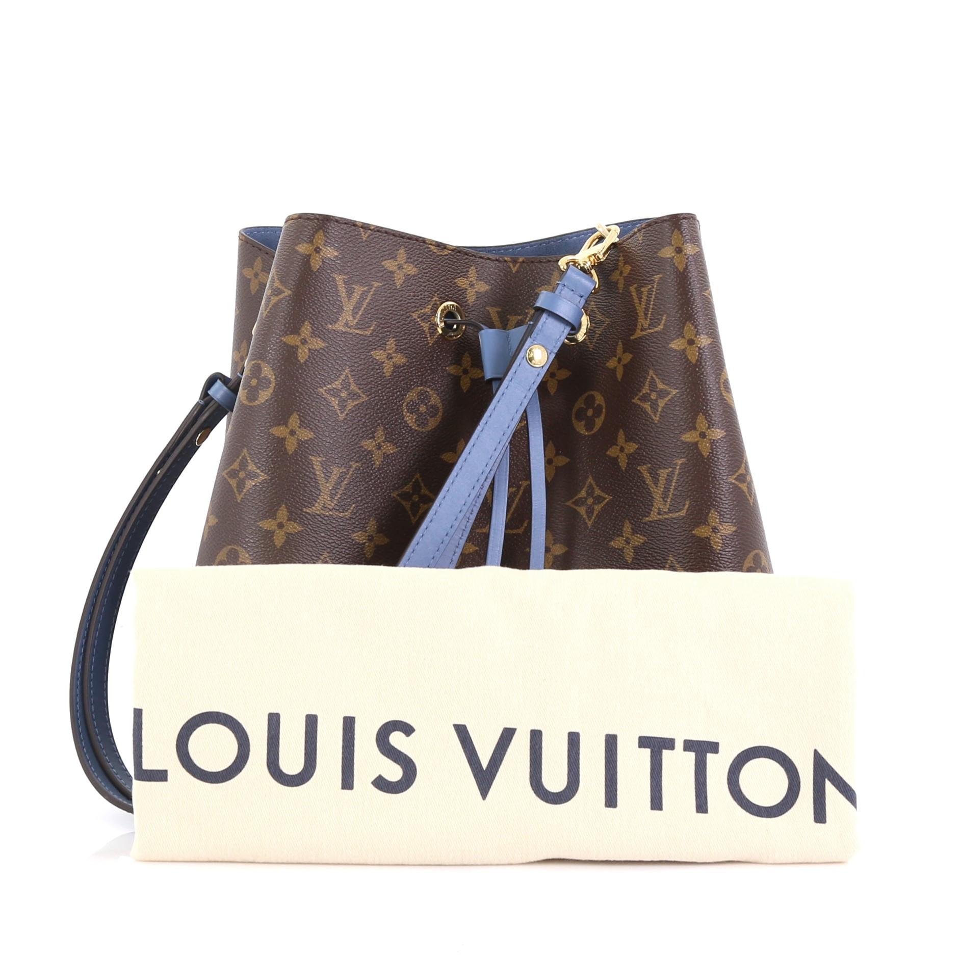 This Louis Vuitton Neonoe Handbag Monogram Canvas, crafted from brown monogram coated canvas and light blue leather, features a leather shoulder strap, leather trim, and gold-tone hardware. Its drawstring closure opens to a light blue microfiber