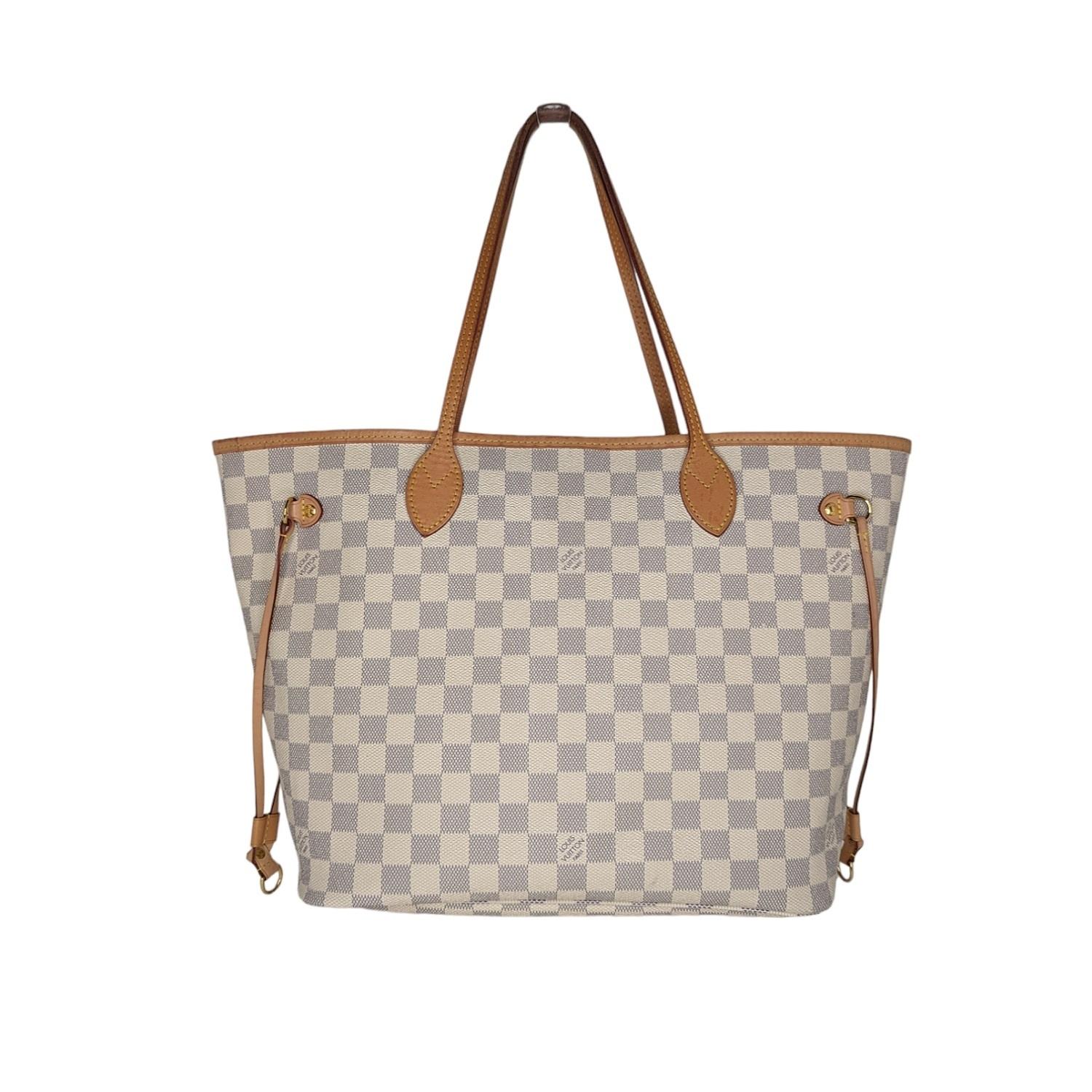 The Neverfull MM tote unites timeless design with heritage details. Made from fresh Damier Azur canvas with natural cowhide trim, it is roomy yet not bulky, with side laces that cinch for a sleek allure or loosen for a casual look. The slim leather