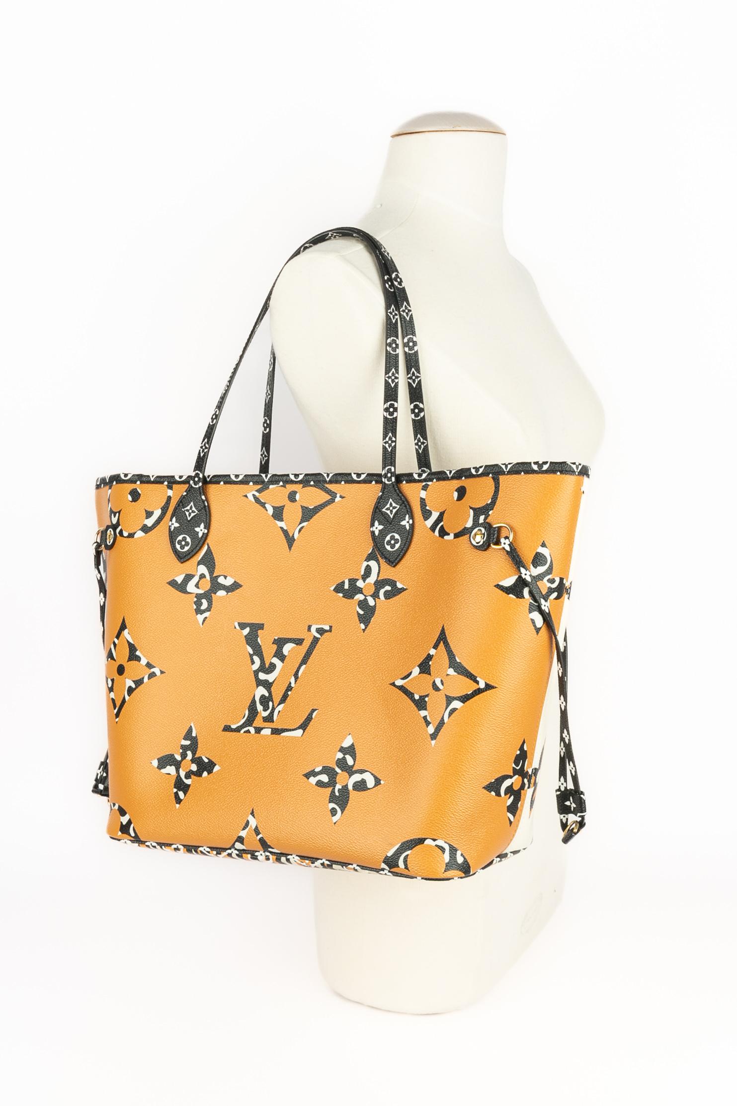 LOUIS VUITTON - (Made in Spain) Monogram coated canvas Neverfull Jungle bag with its enveloppe. A 2019 Collection - limited edition.

Condition:
Very good condition

Dimensions:
Length: 32 cm to 48 cm - Height: 28 cm - Depth: 16 cm - Handle: 50