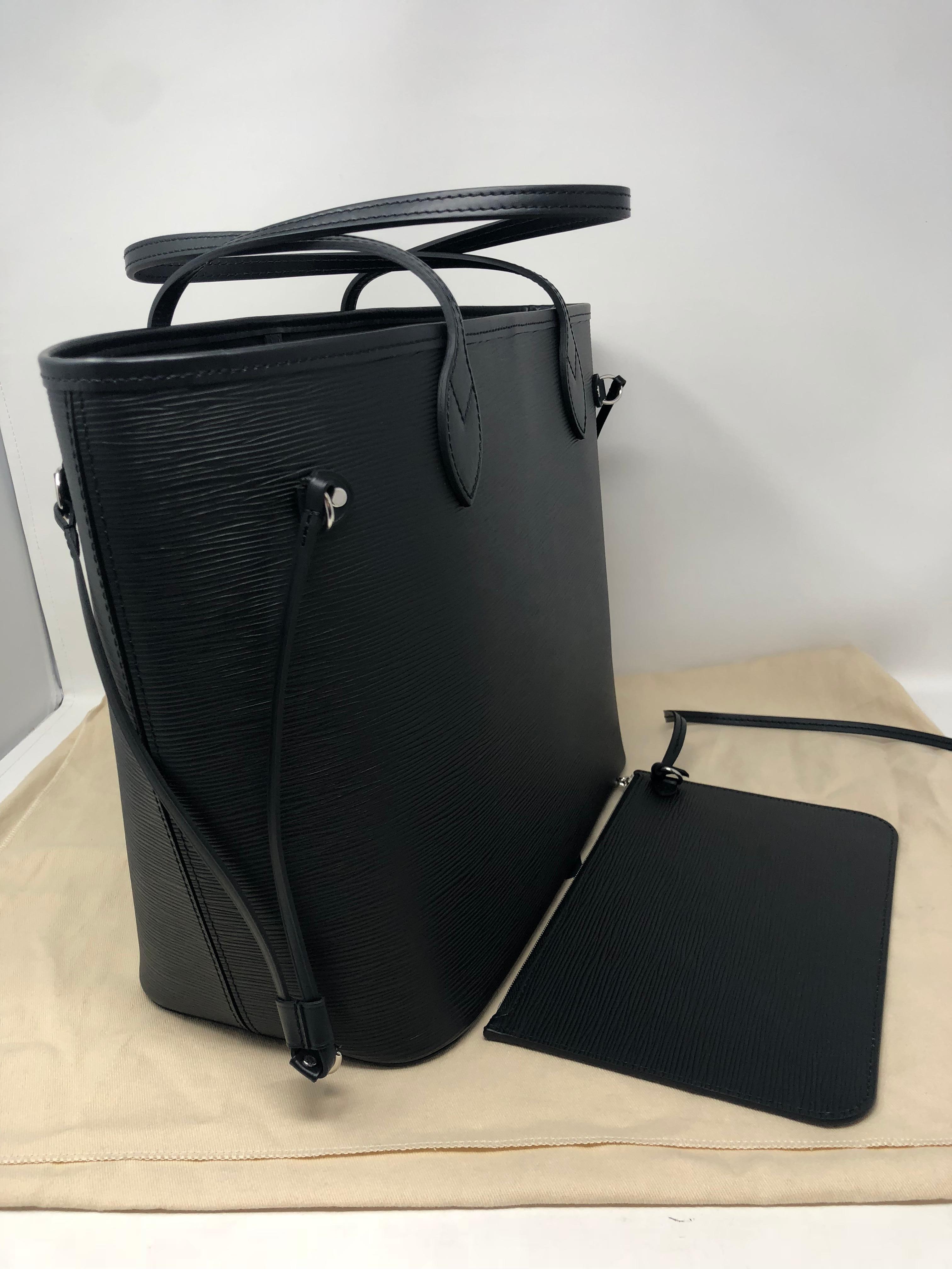 Louis Vuitton Black Neverfull in Epi leather. Comes with pouch insert also in black epi leather. Brand new and never used. Includes original dust cover and LV box. Black epi leather is very durable and lasts. Black goes with everything. Classic